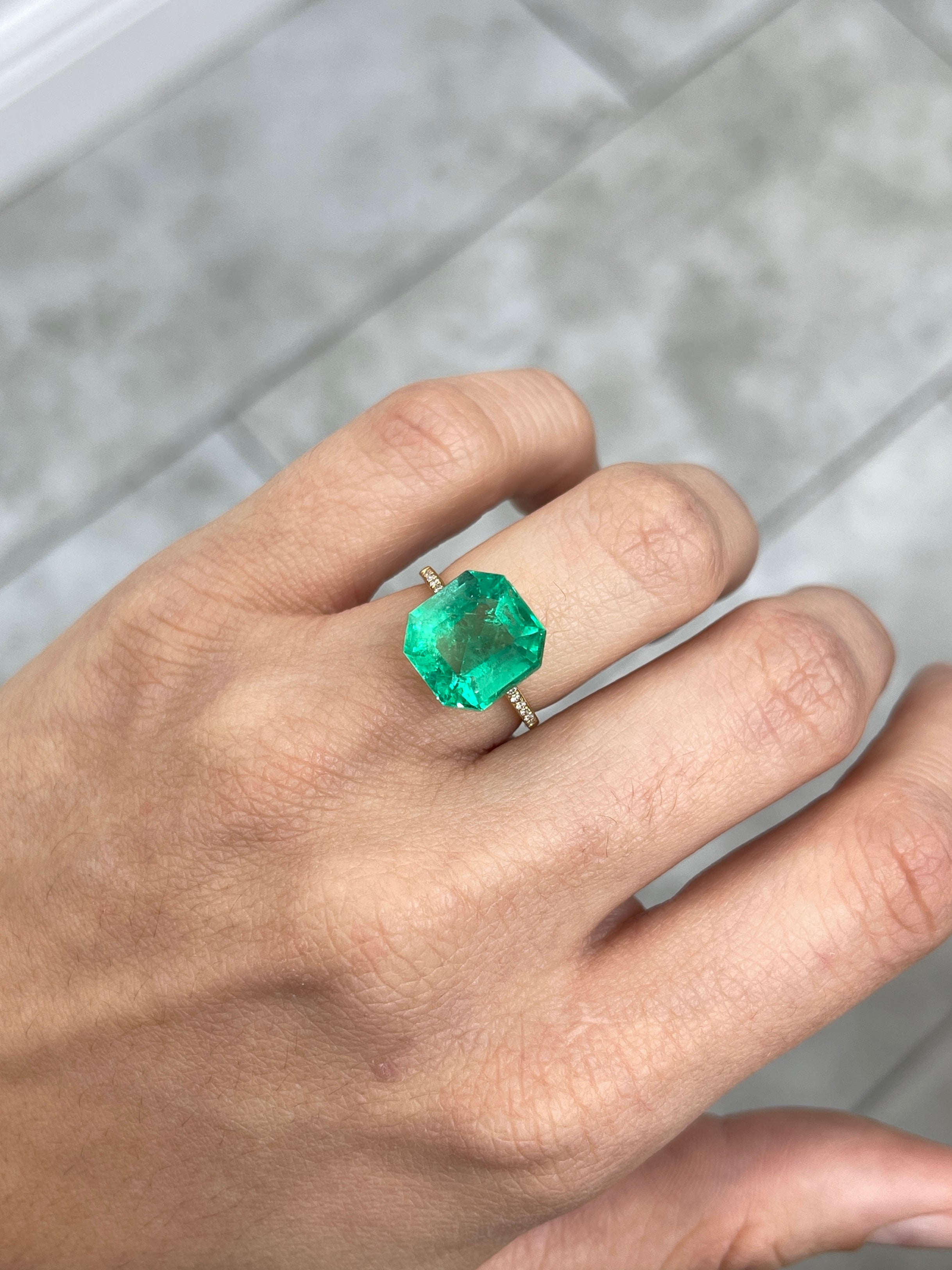 6.76 carat glowing green natural Colombian emerald Asscher cut gemstone, loose and vibrant, from JR Colombian Emeralds.
