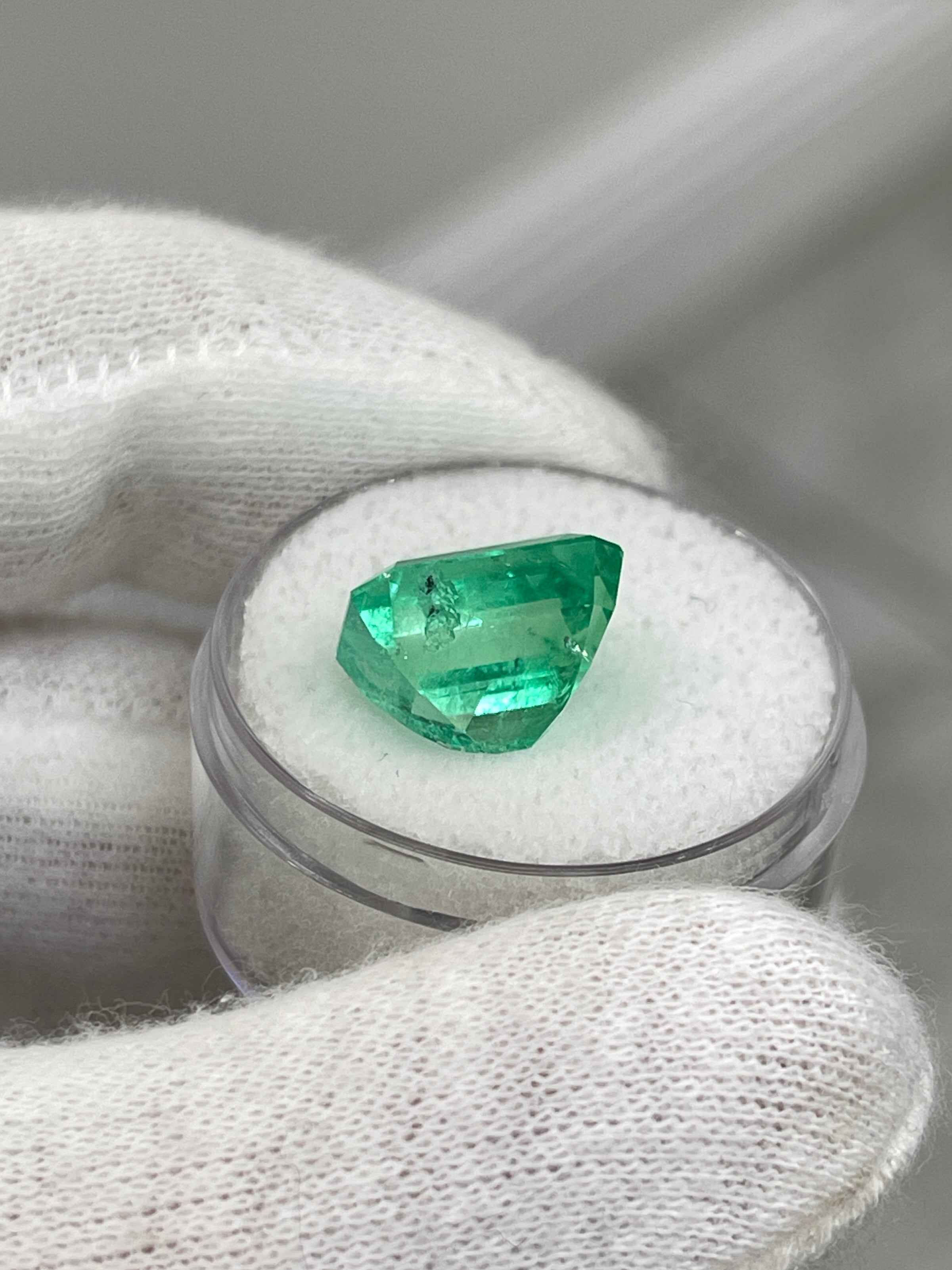 Luminous 6.79 carat natural Colombian emerald loose gemstone in classic emerald cut, ethically mined by JR Colombian Emeralds.