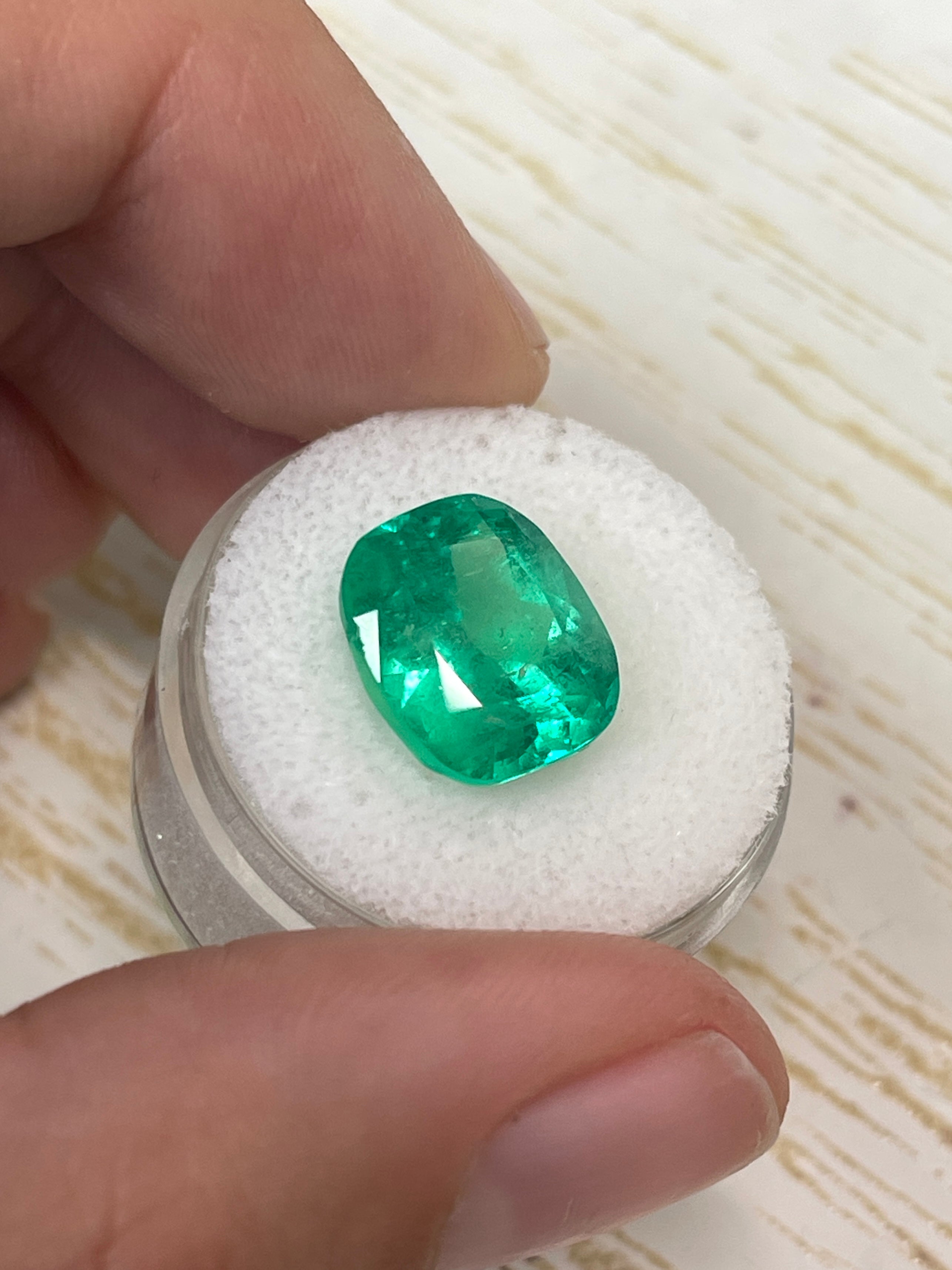 7.08 carat Muzo green Colombian emerald loose cushion cut, natural gemstone with vibrant green color and clarity.
