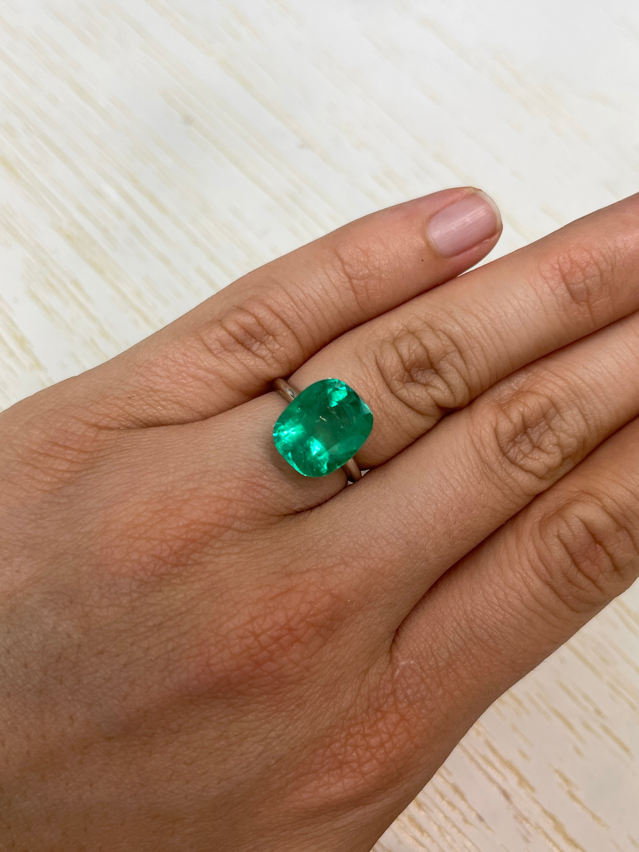 7.08-carat Muzo green Colombian emerald, cushion cut, natural loose gemstone, from JR Colombian Emeralds.