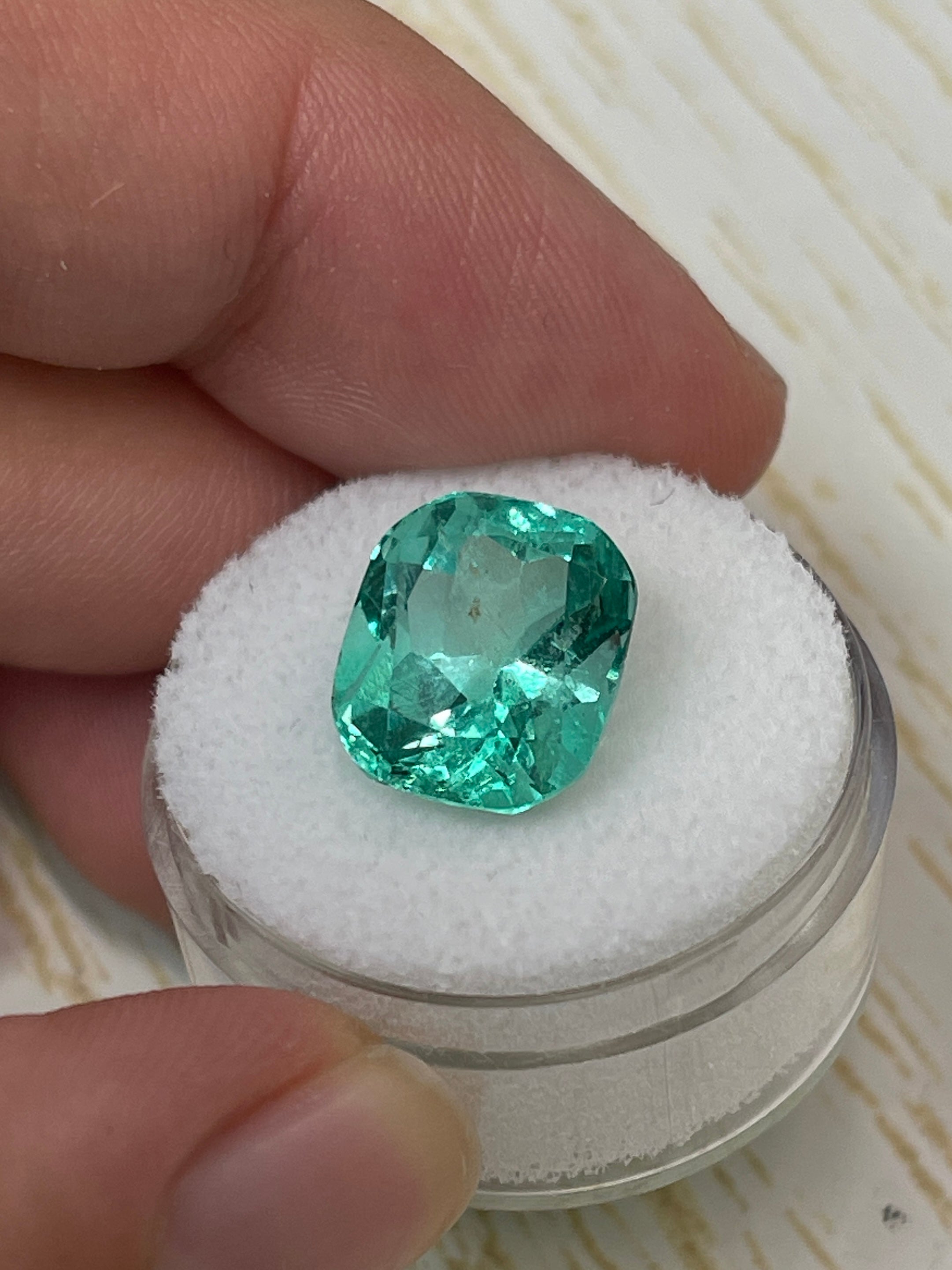 7.13 carat bluish green Colombian emerald loose cushion cut gemstone from JR Colombian Emeralds. Natural and vivid color.