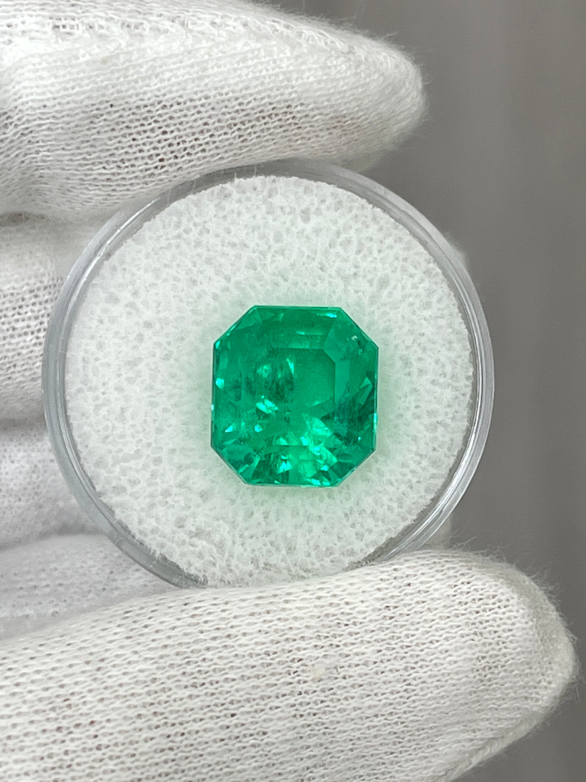 7.37 carat Muzo intense green Colombian emerald loose Asscher cut gem from JR Colombian Emeralds