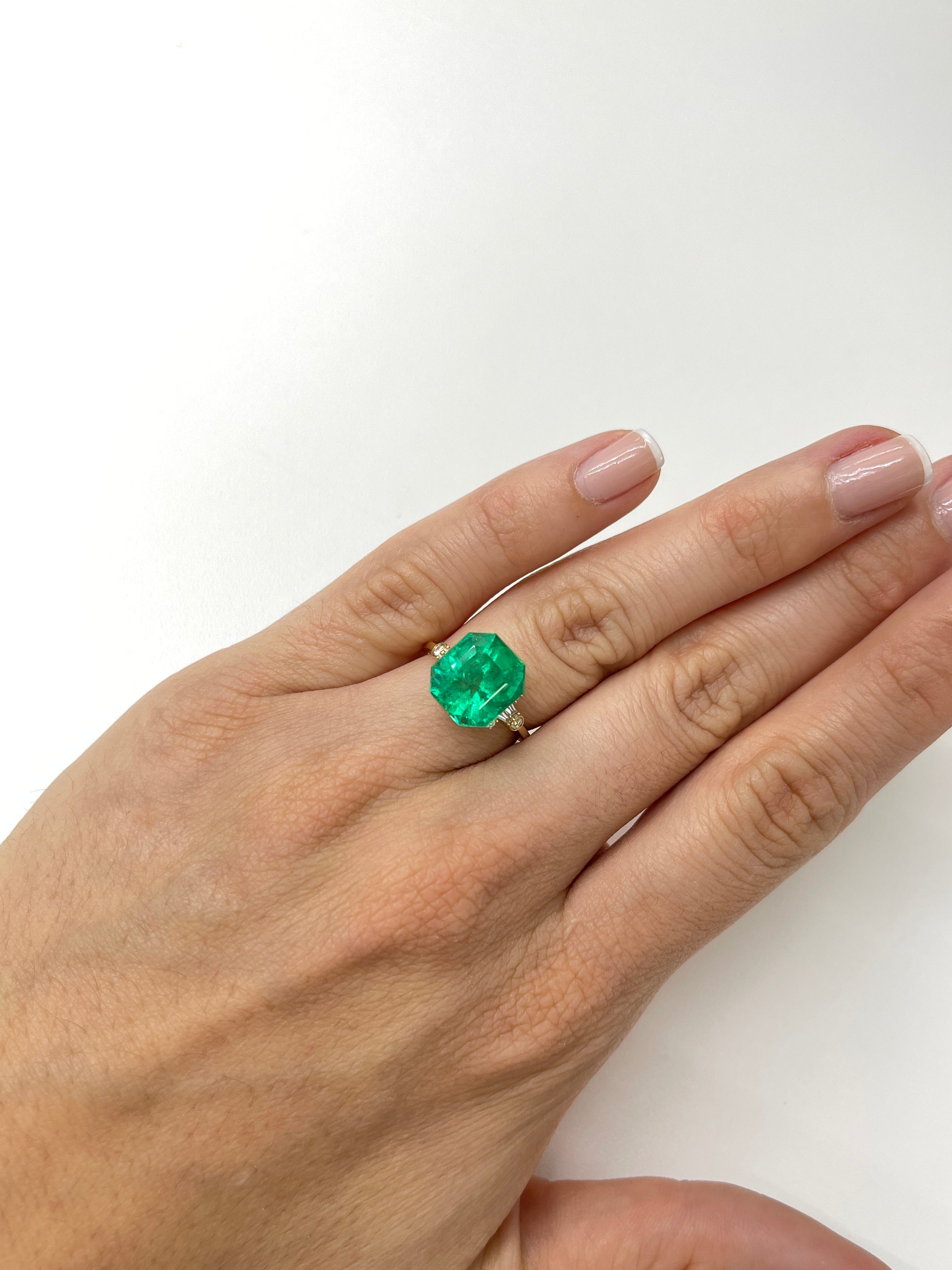 7.37 carat Muzo intense green Colombian emerald loose Asscher cut gemstone from JR Colombian Emeralds.