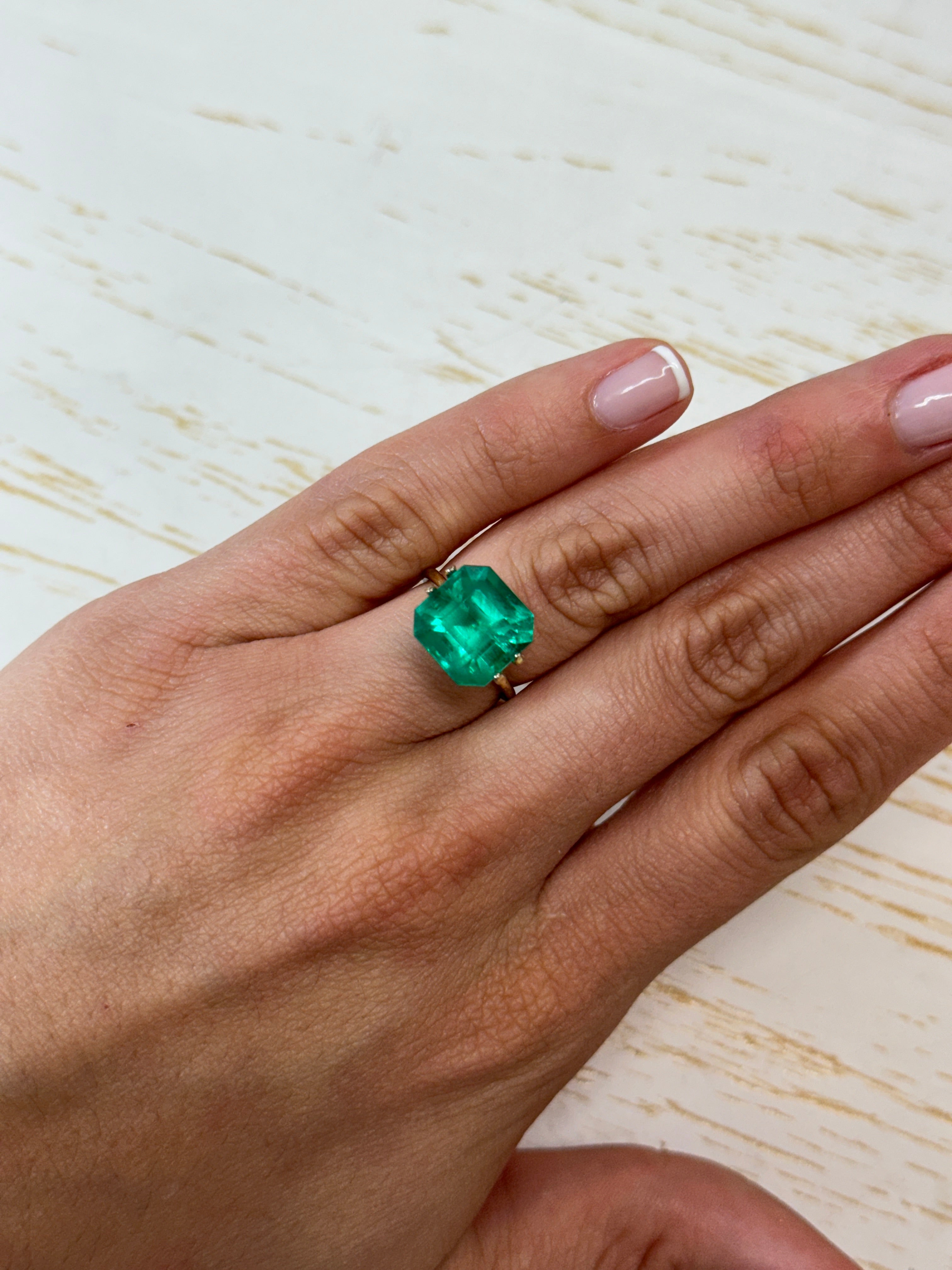7.38-carat intense bluish-green natural Colombian emerald loose Asscher cut showcasing vibrant color and clarity