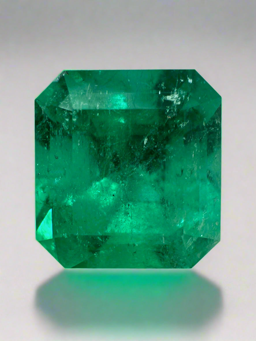 7.40 carat Muzo intense green natural Colombian emerald loose gem in Asscher cut, showcasing vibrant green color and clarity.