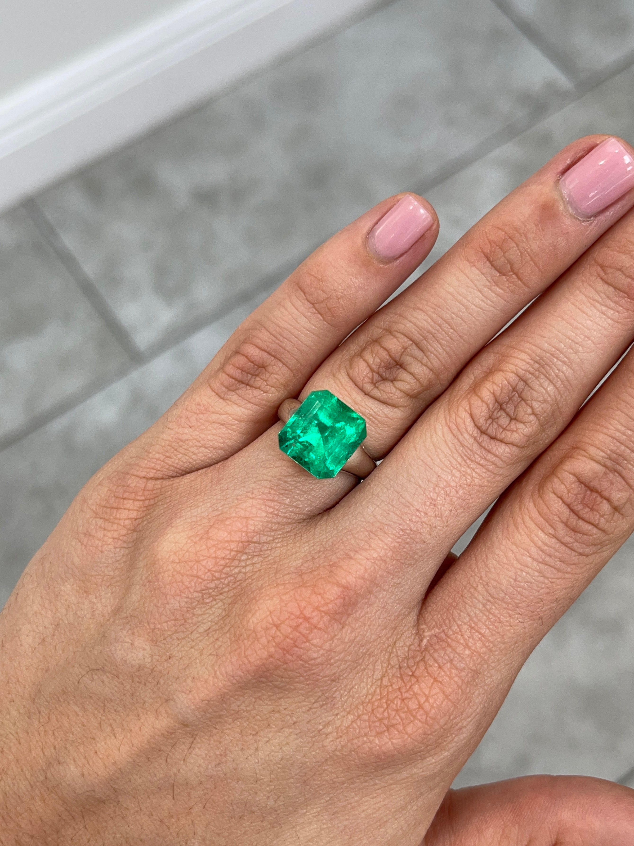 7.40 carat Muzo intense green Colombian emerald loose Asscher cut gemstone from JR Colombian Emeralds.