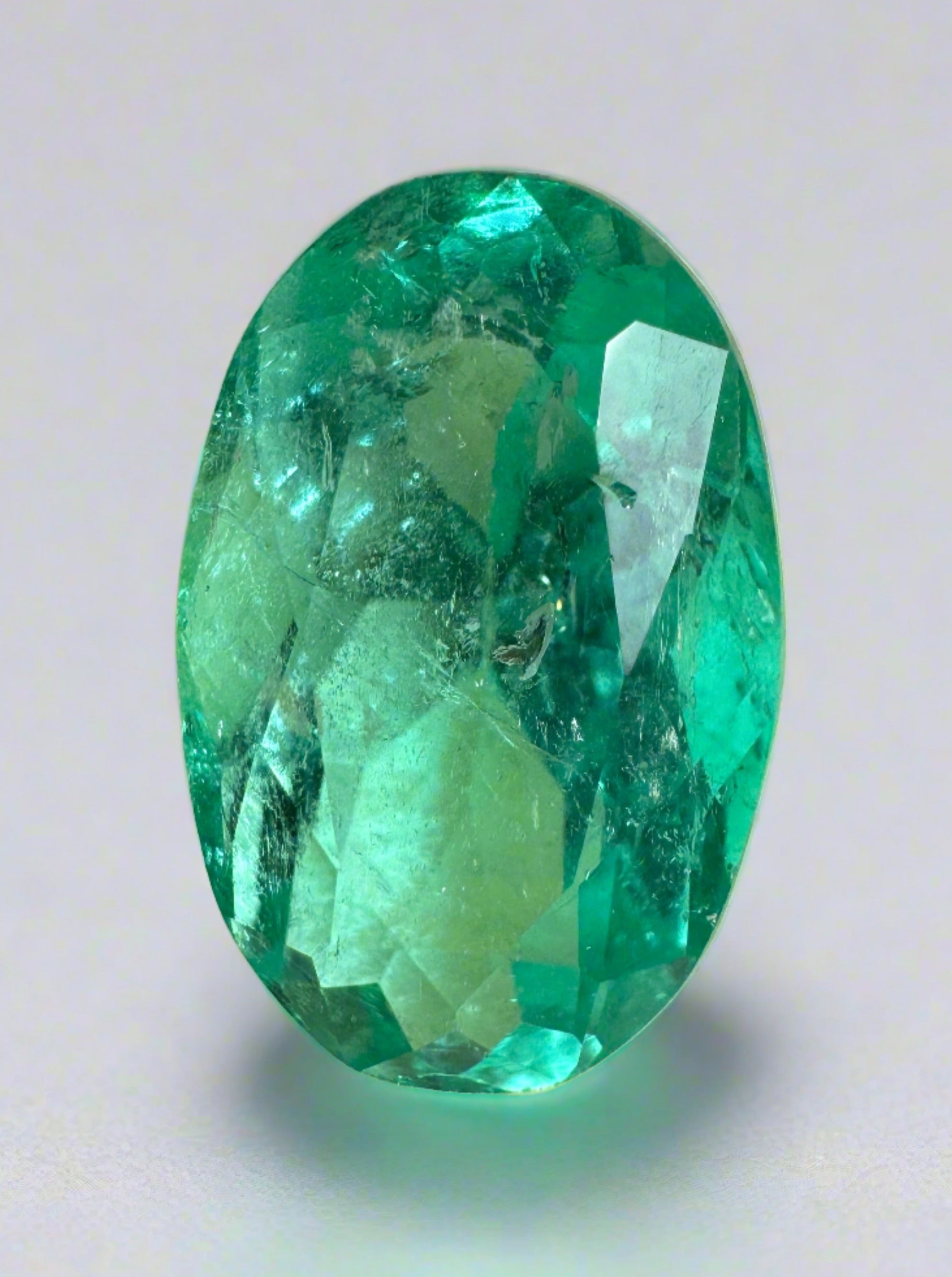 7.55 carat elongated bluish green Colombian emerald loose stone with oval cut from JR Colombian Emeralds.