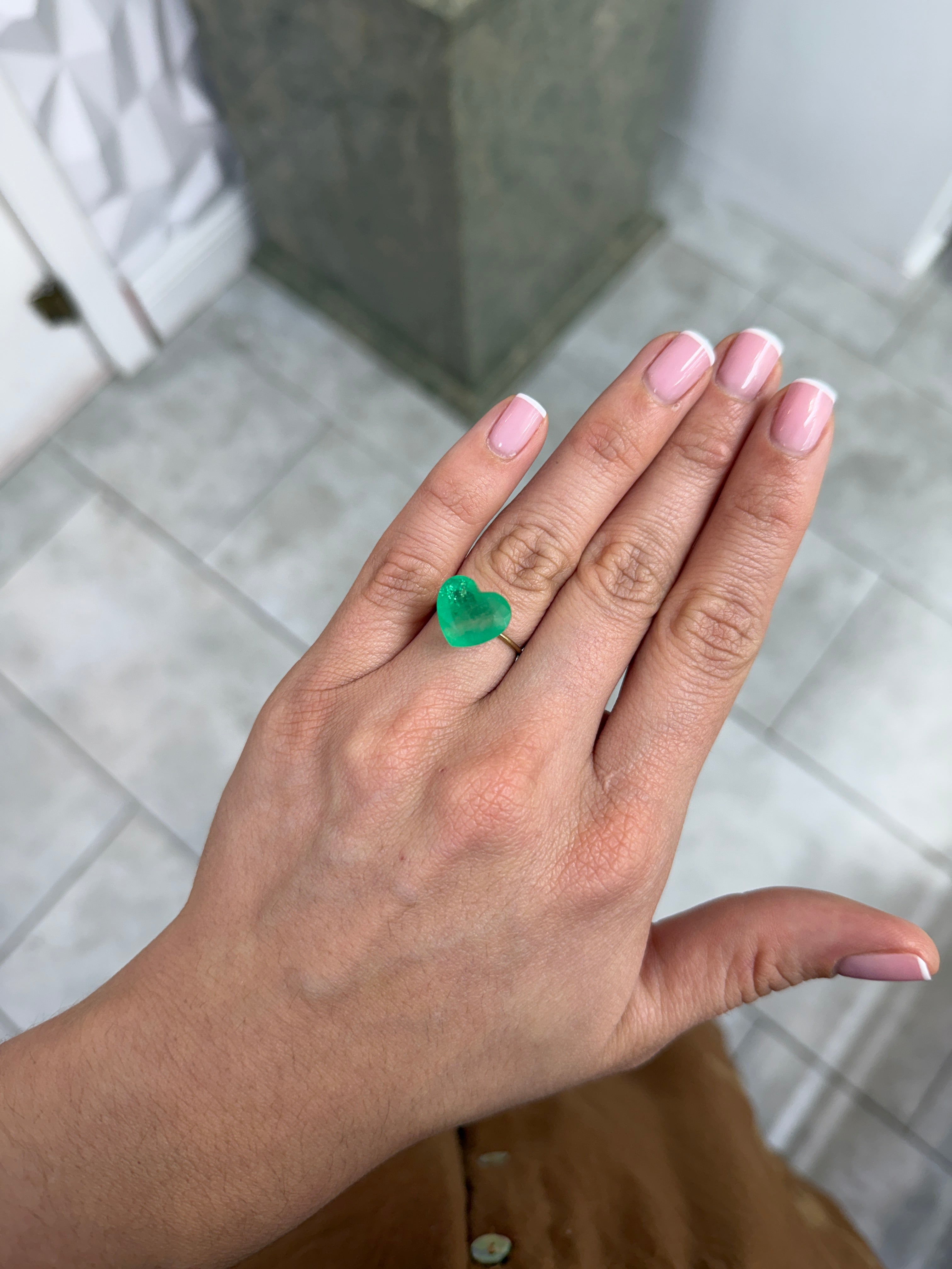 Natural 7.68 carat earthy green Colombian emerald loose heart cut gemstone from JR Colombian Emeralds.