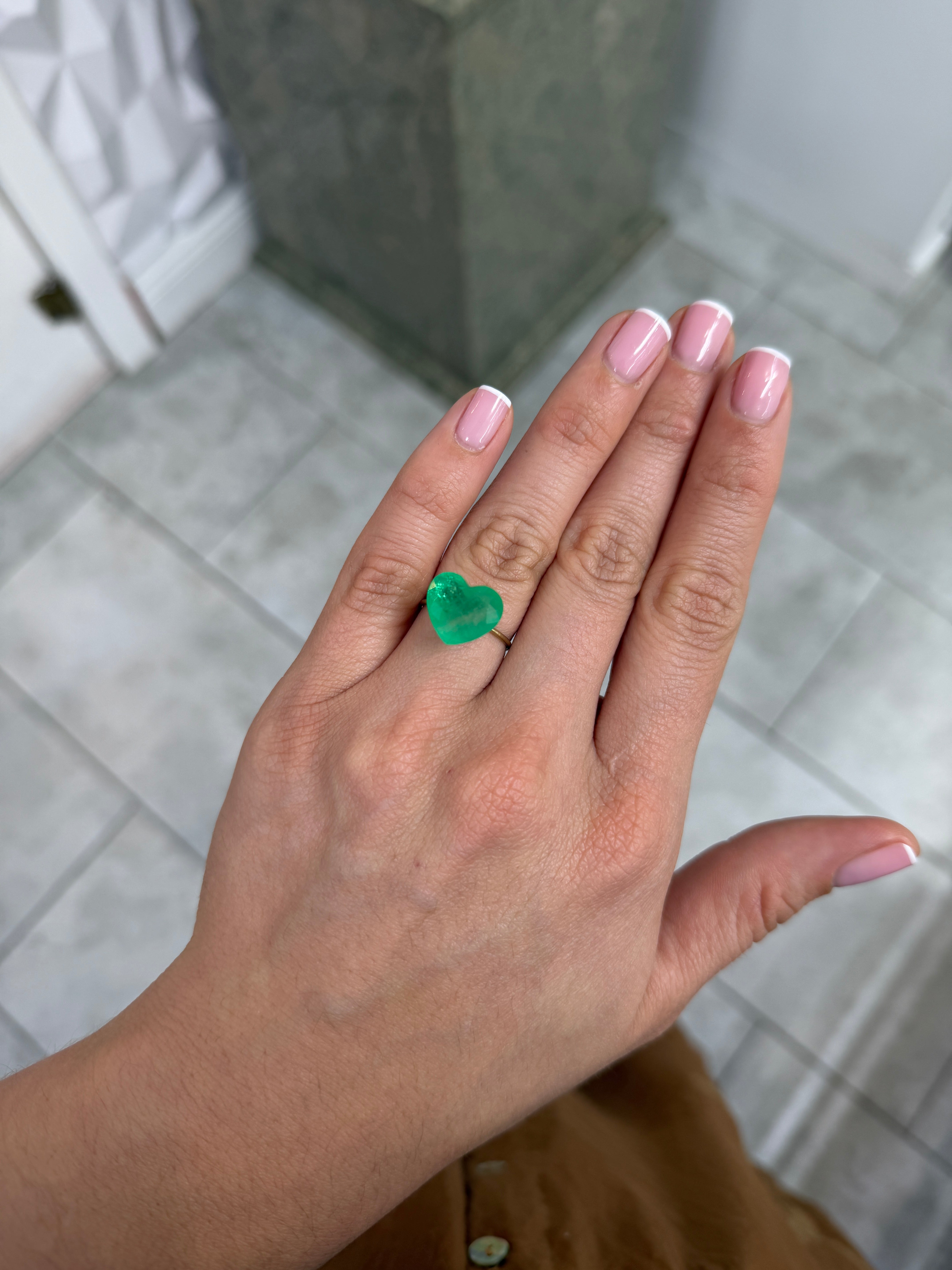 Natural 7.68 carat earthy green Colombian emerald loose heart-cut gemstone from JR Colombian Emeralds.