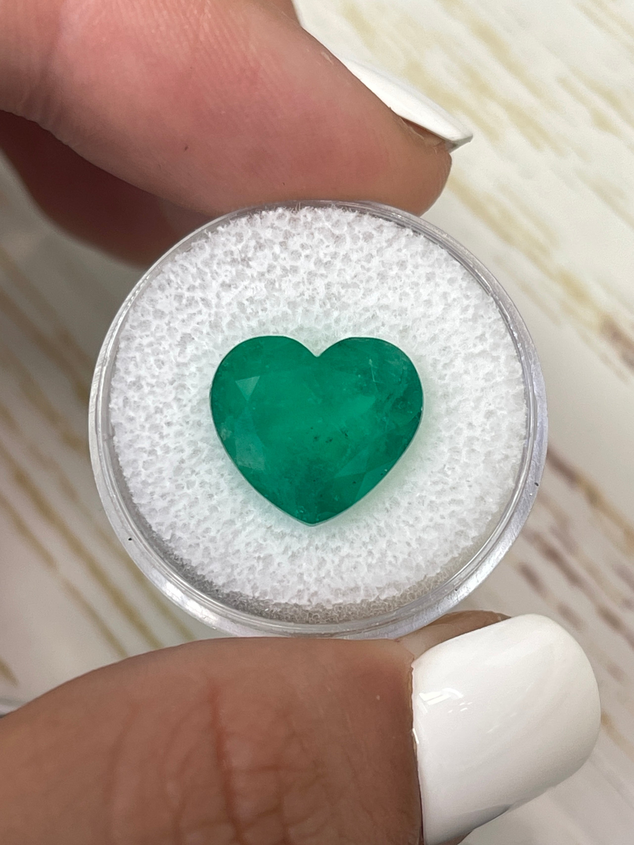 Natural 7.68 carat forest green Colombian emerald loose heart cut gemstone from JR Colombian Emeralds.