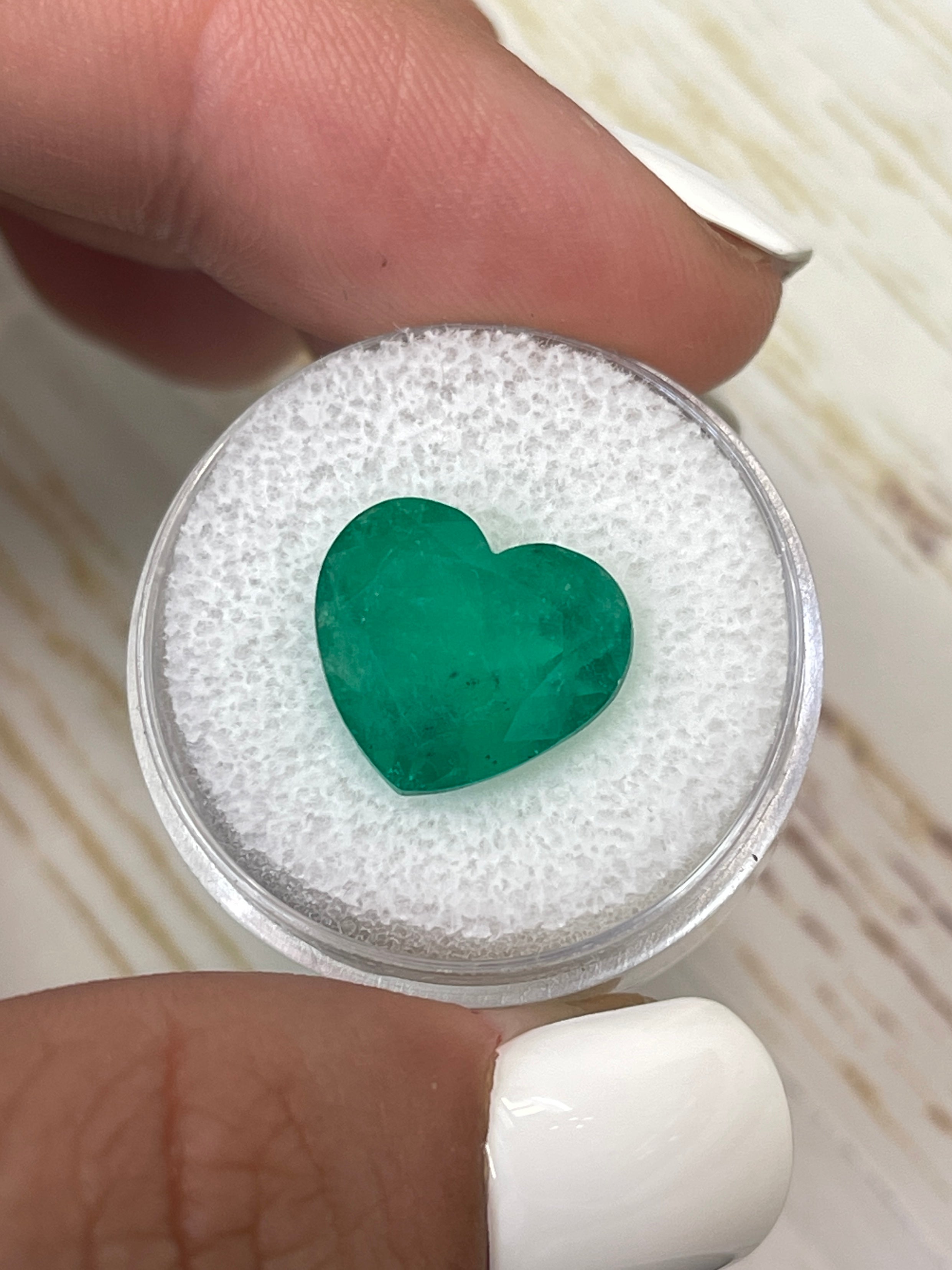Natural 7.68 carat forest green Colombian emerald loose heart cut gemstone by JR Colombian Emeralds.