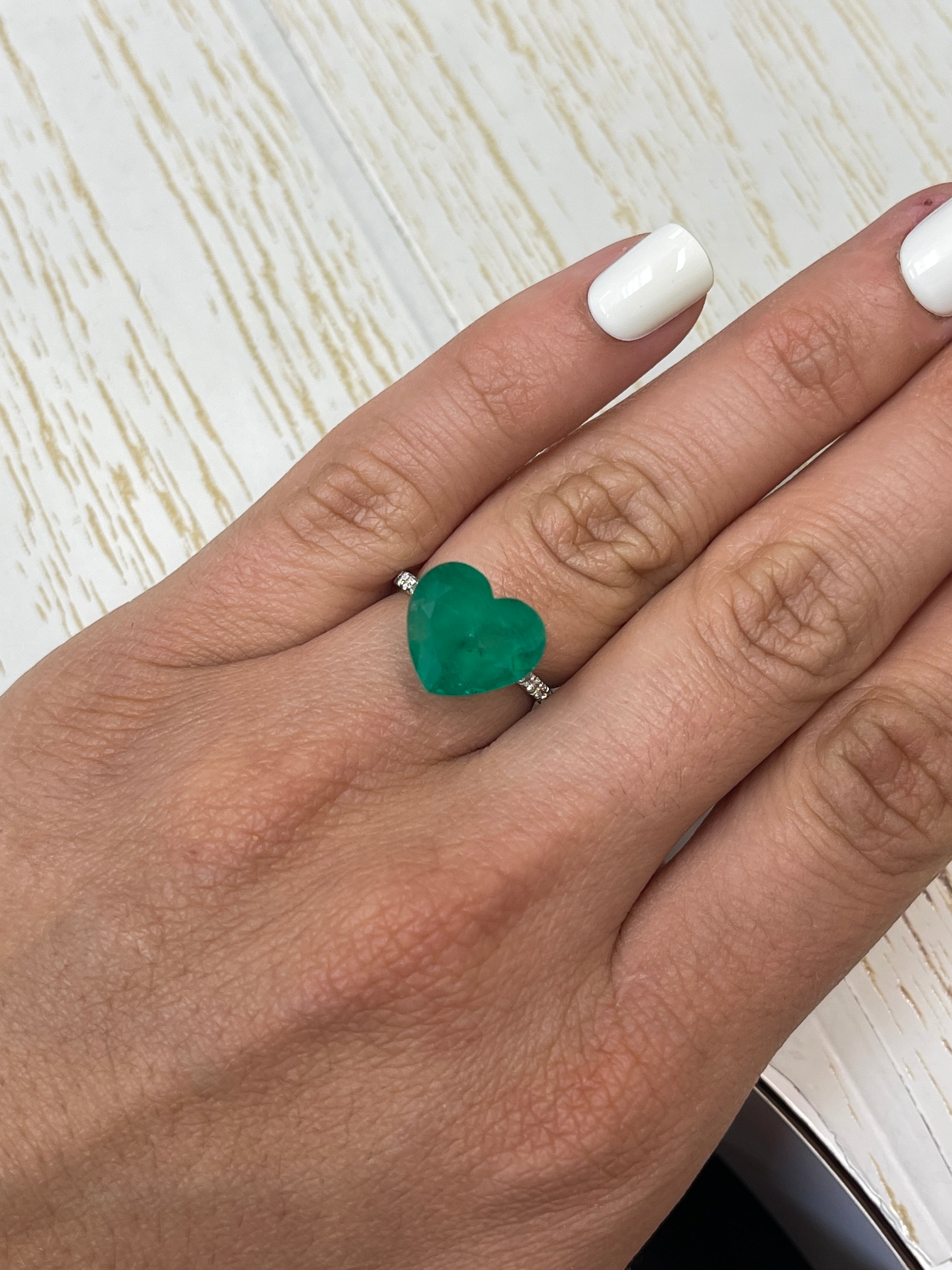 7.68-carat forest green Colombian emerald loose gemstone, heart cut, natural and radiant, from JR Colombian Emeralds.