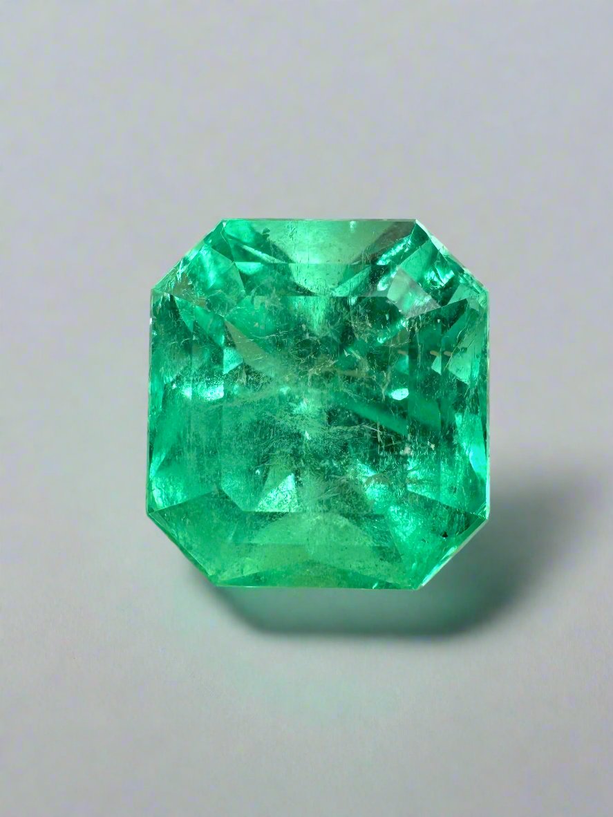 7.76 carat yellowish green natural Colombian emerald loose Asscher cut gemstone with facets and clarity details.