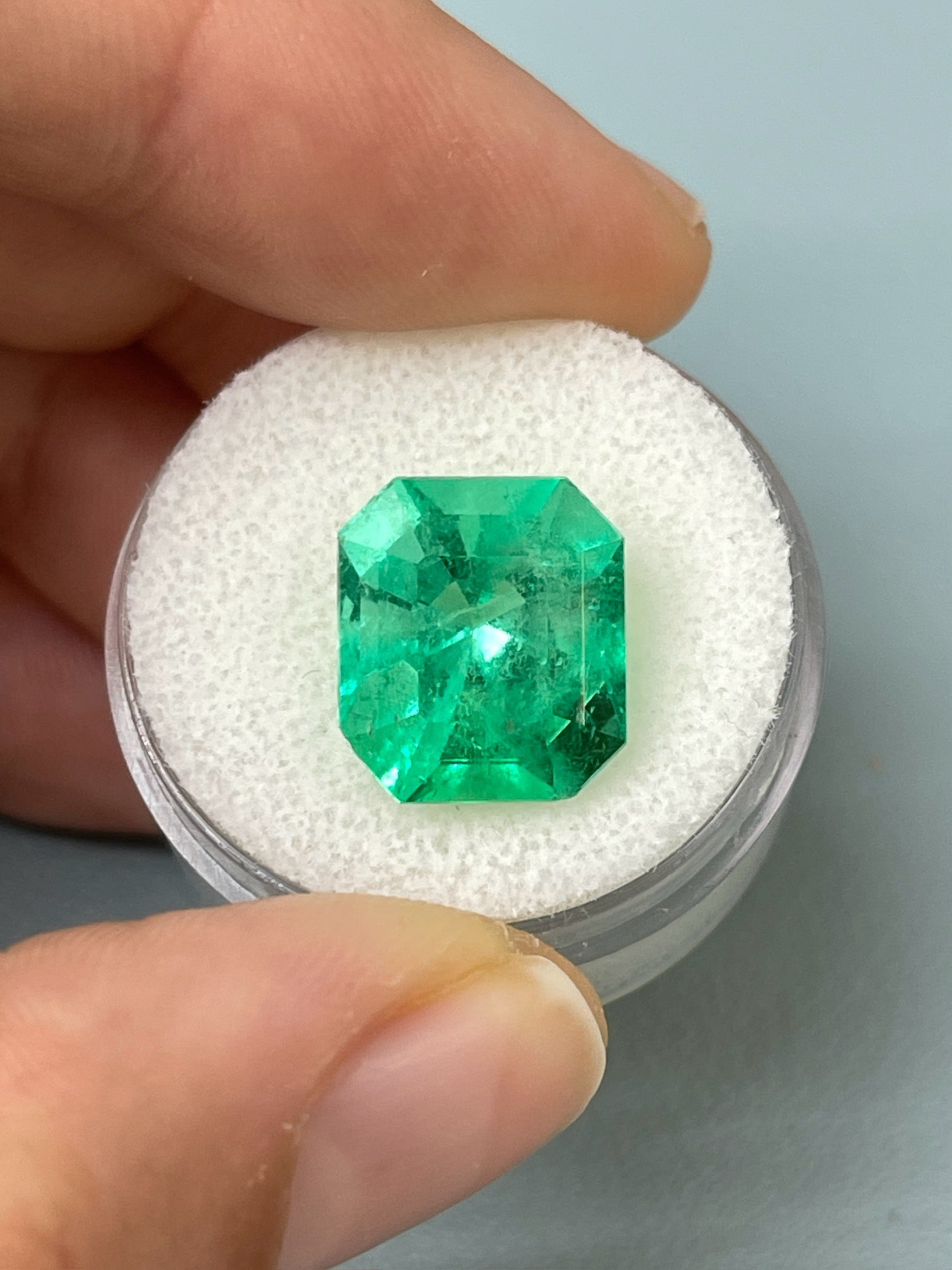 7.92-carat Colombian emerald cut loose gemstone with chunky 13x11.5mm emerald shape, vibrant green color, from JR Colombian Emeralds.