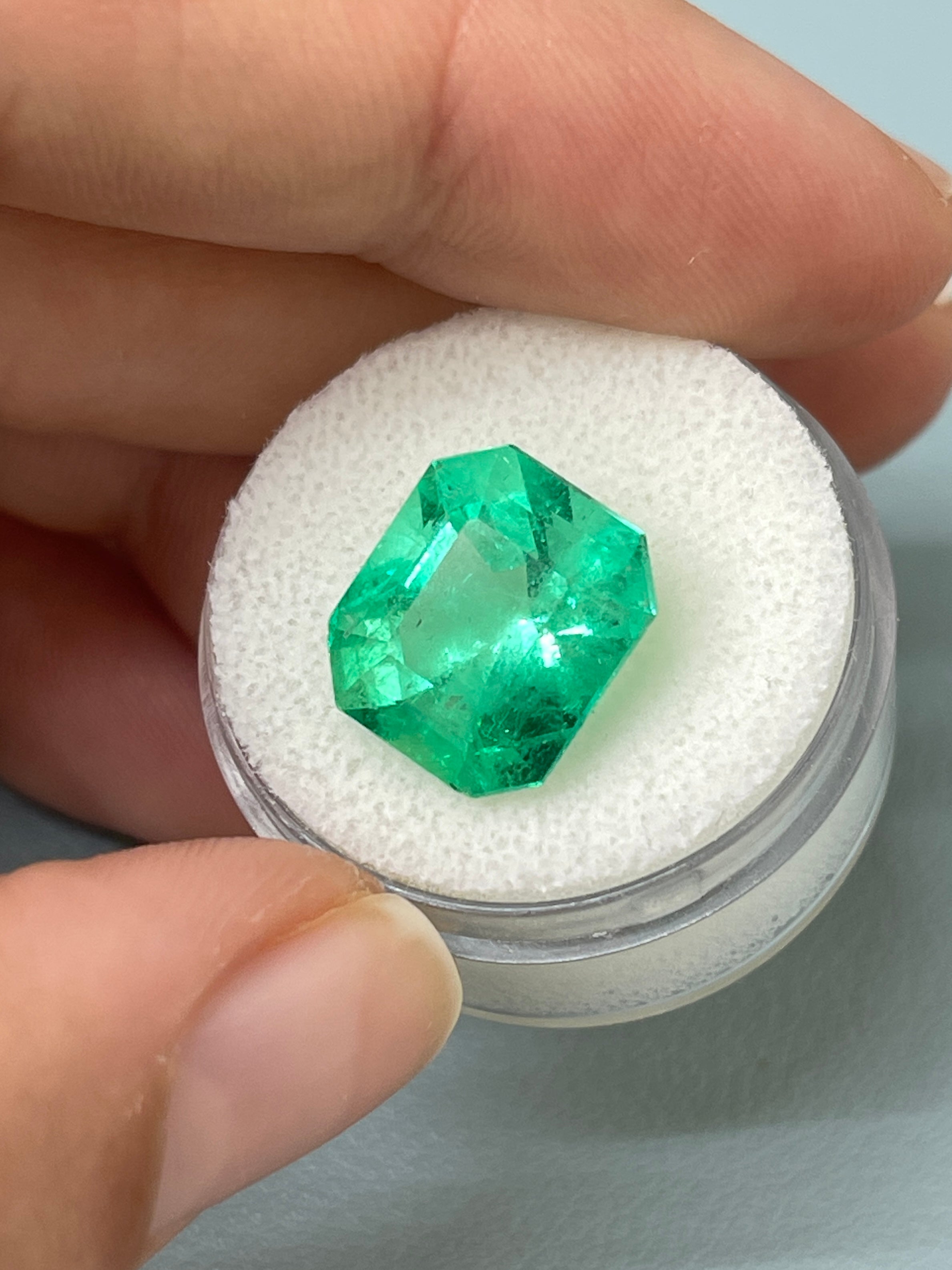 7.92 carat Colombian emerald cut loose emerald from JR Colombian Emeralds, showcasing a chunky 13x11.5 mm gemstone.