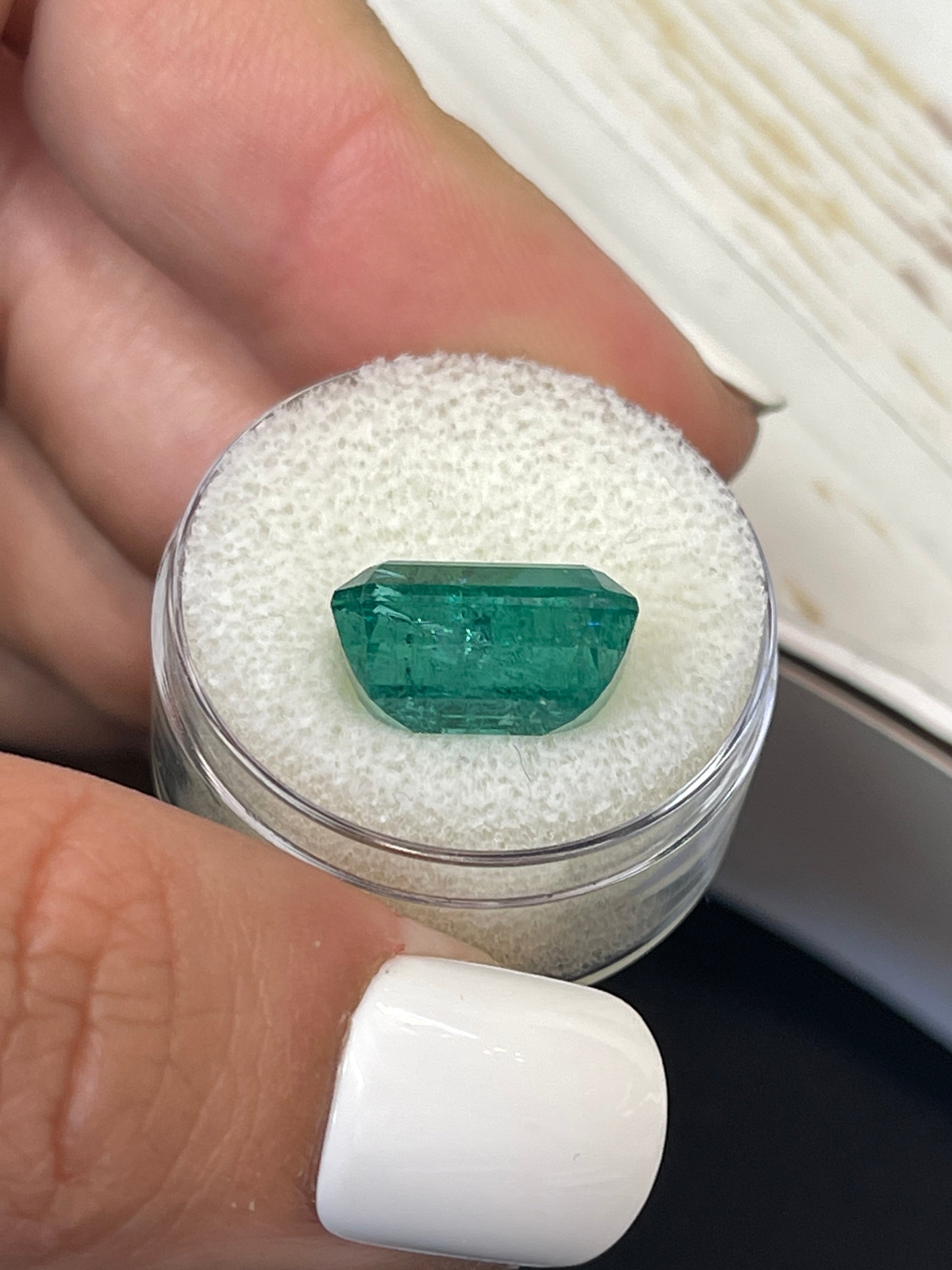 7.96-carat elongated green Zambian emerald cut natural loose gemstone from JR Colombian Emeralds.