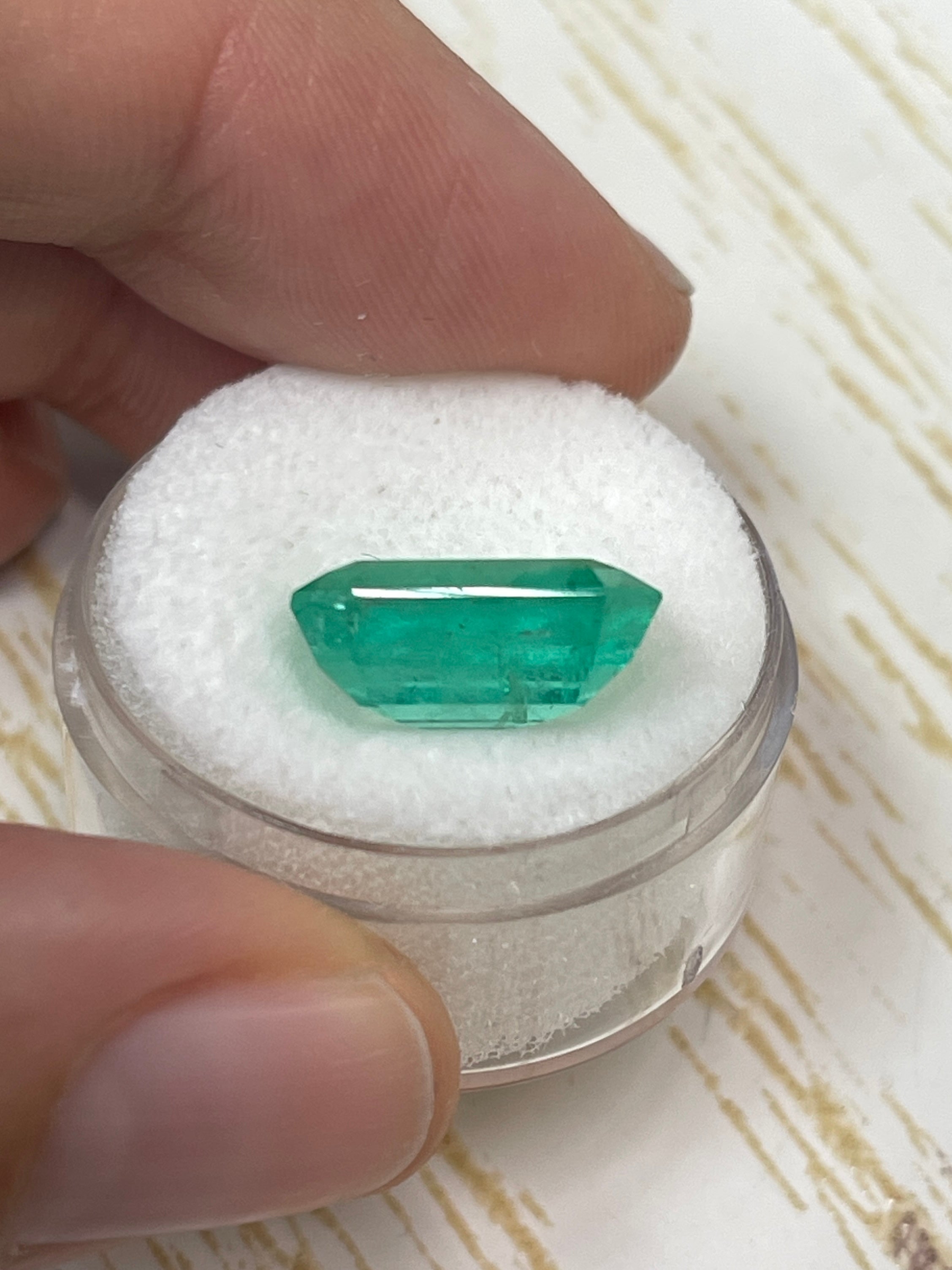 Medium green 8.20 carat Colombian emerald cut loose gemstone with a 14x11.4 mm size from JR Colombian Emeralds.