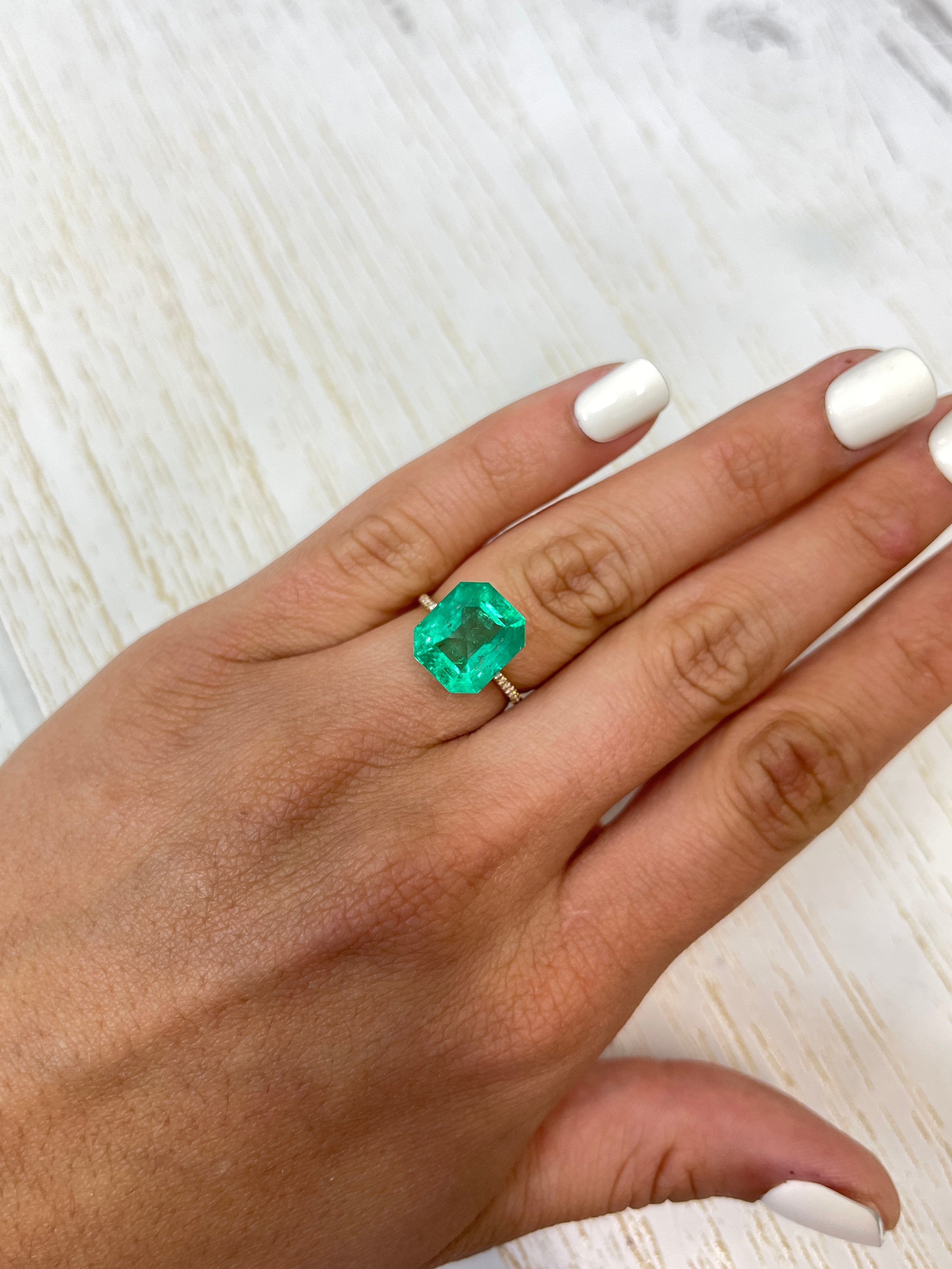 8.51 carat Colombian emerald cut loose emerald from JR Colombian Emeralds, showcasing a classic 13x11 mm rectangular shape.