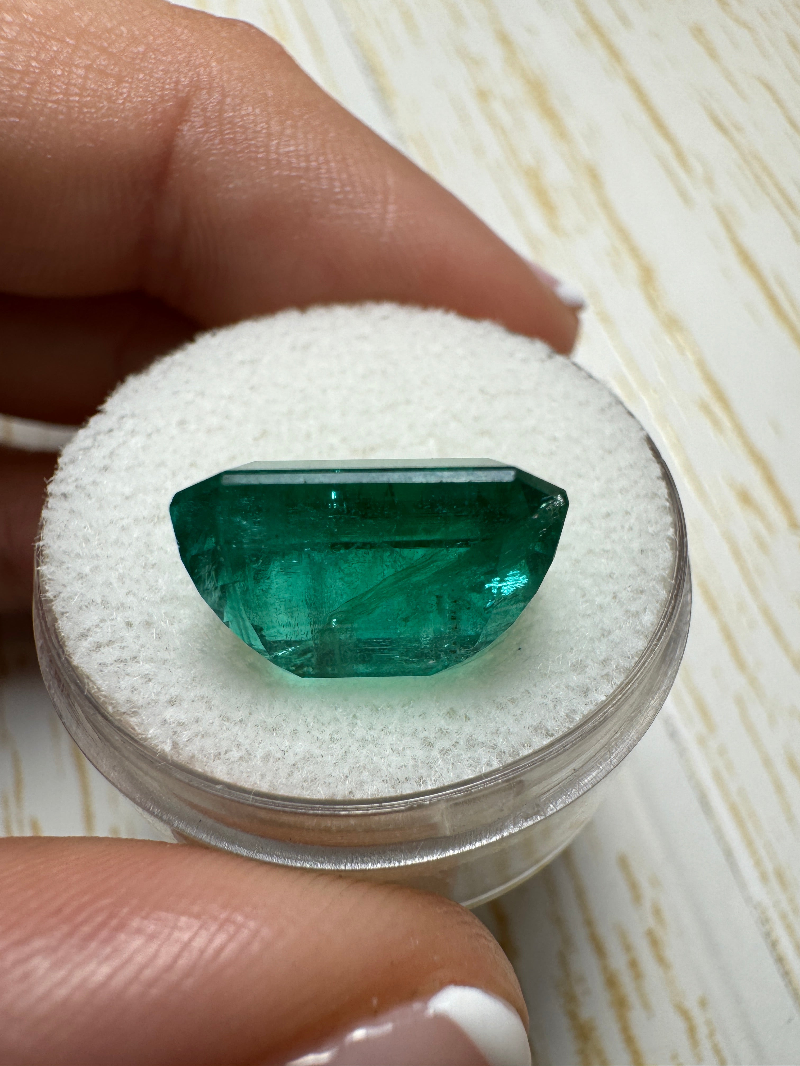 Deep green 8.60 carat Zambian emerald cut loose emerald from JR Colombian Emeralds, showcasing vibrant color and clarity.