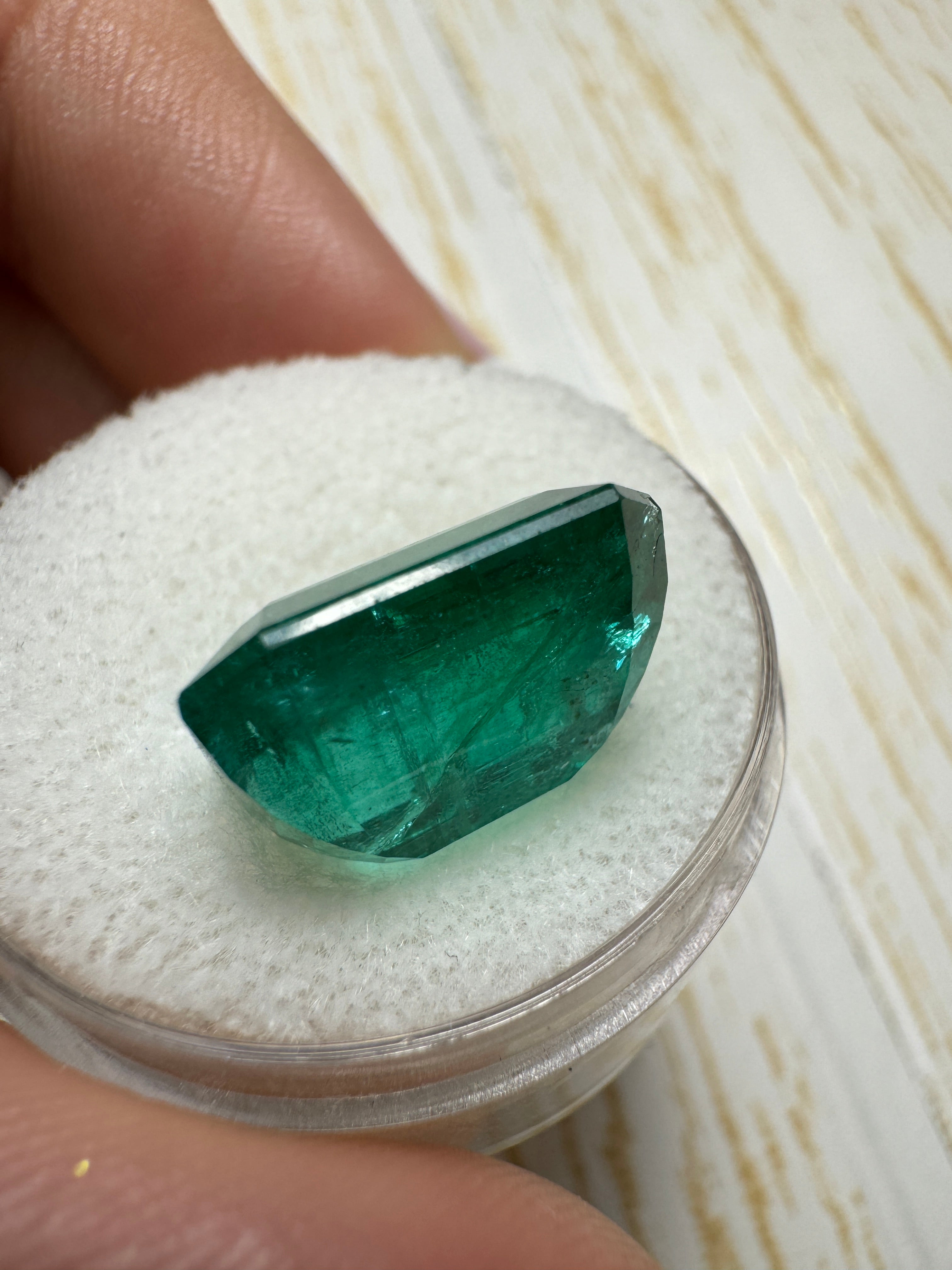 Deep green 8.60 carat Zambian emerald cut loose gemstone from JR Colombian Emeralds, showing vibrant color and clarity.