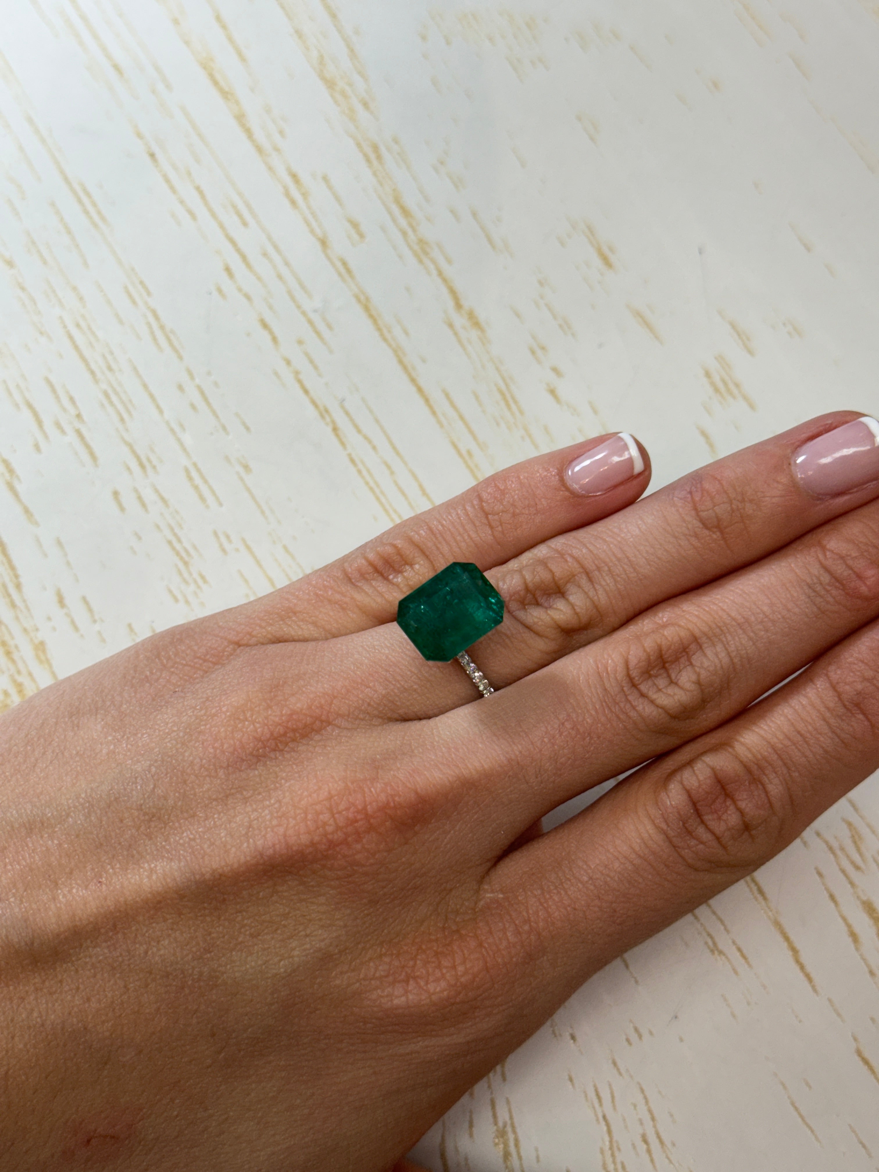 Deep green 8.60 carat Zambian emerald cut loose gemstone from JR Colombian Emeralds, showcasing a vibrant, faceted emerald.
