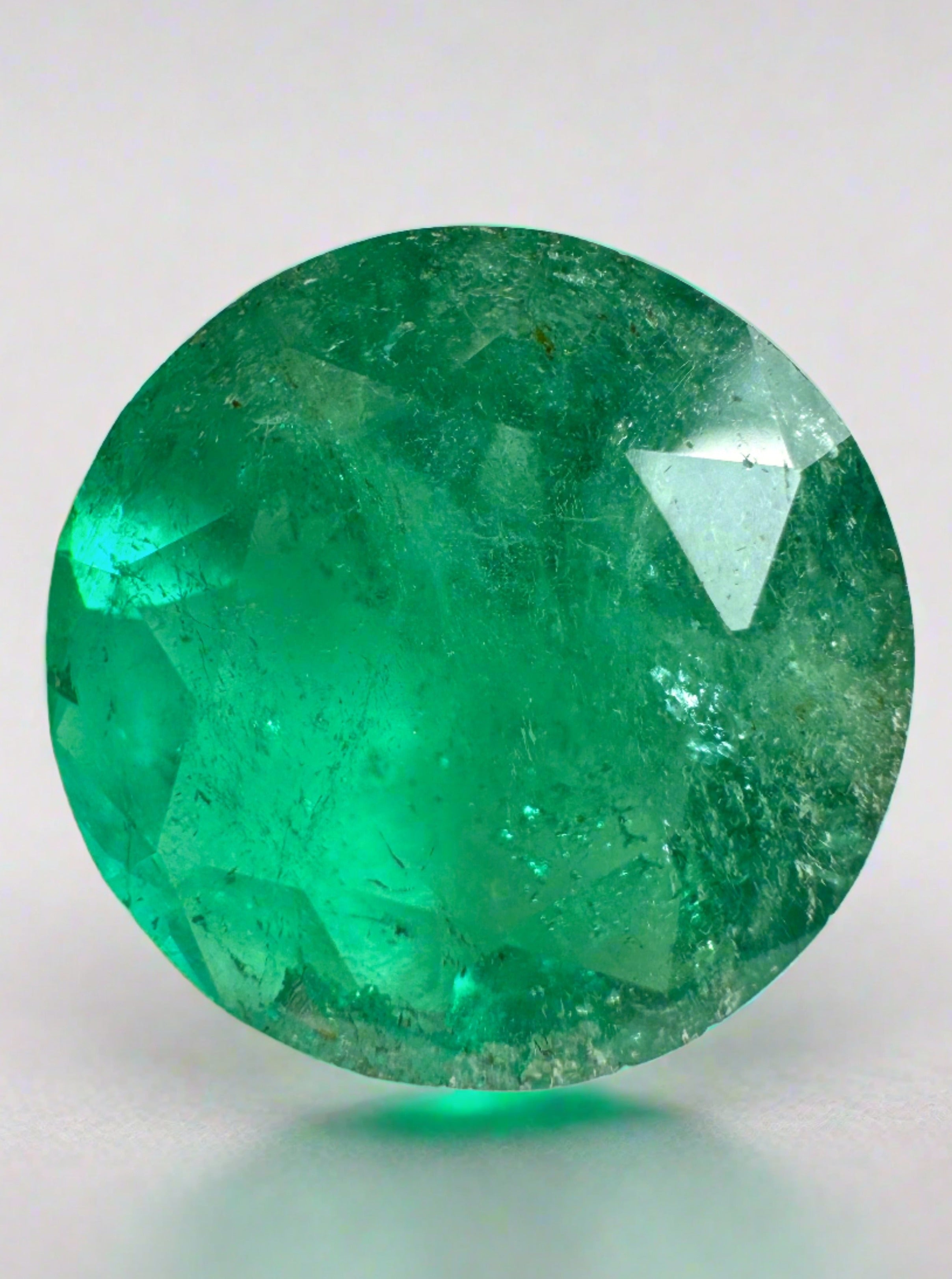 8.80 carat deep green natural round Colombian emerald loose gemstone with 14.5x14.5mm size, from JR Colombian Emeralds.