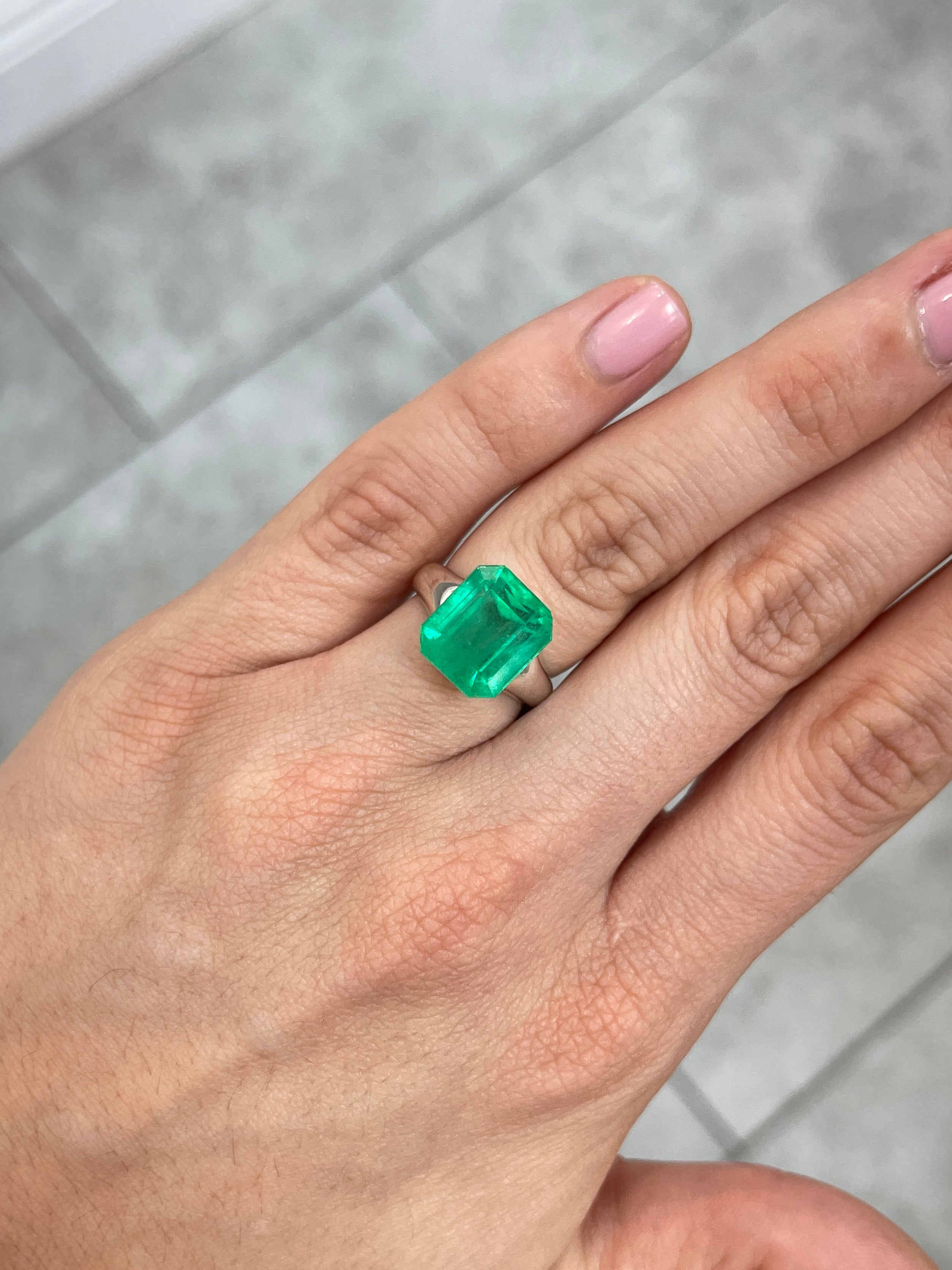 Vivid 8.98 carat Colombian emerald in 13x11mm emerald cut, loose gemstone from JR Colombian Emeralds.