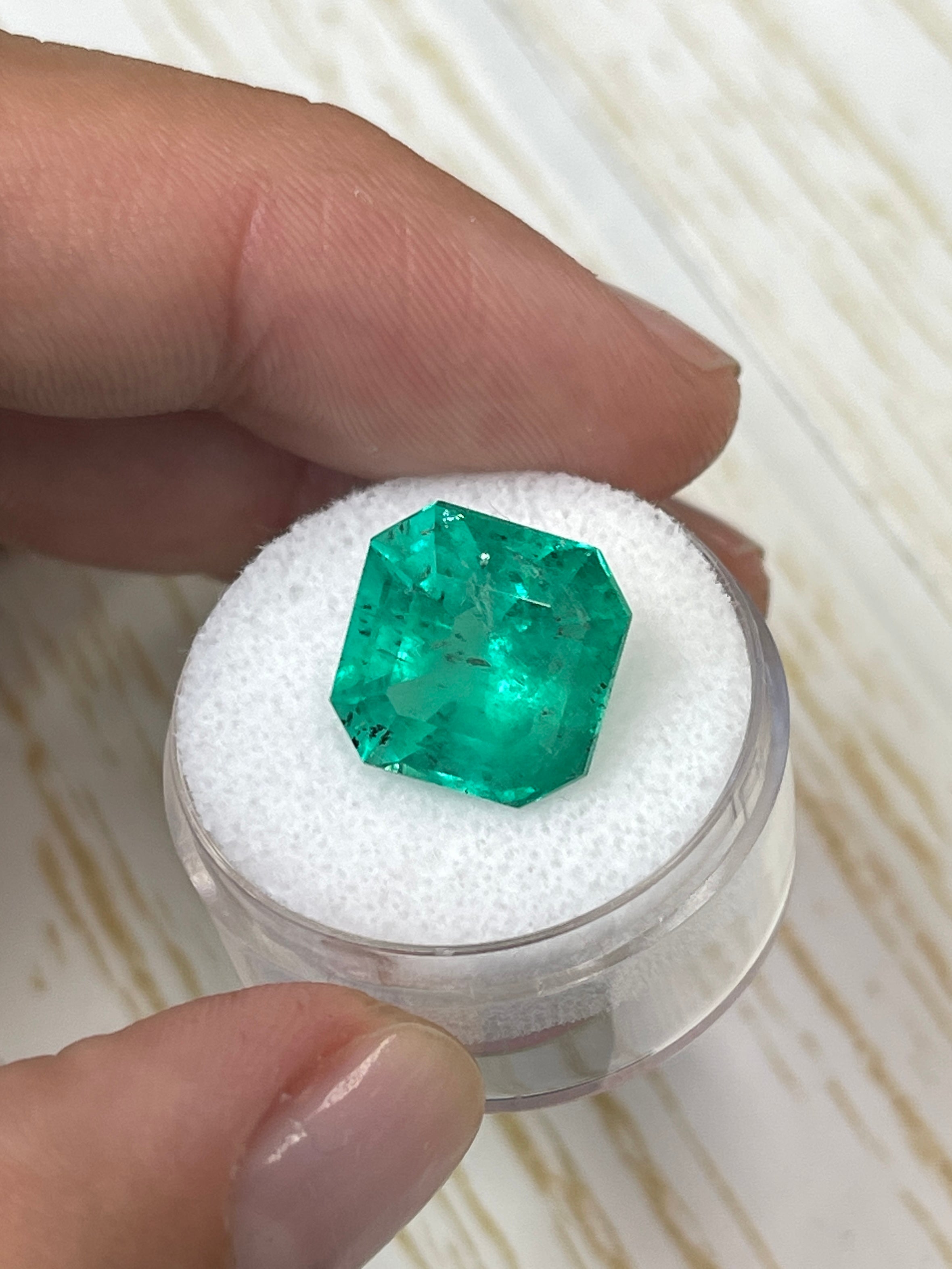 Large 9.03 carat green natural Colombian emerald in Asscher cut, showcasing vibrant color and clarity, from JR Colombian Emeralds.