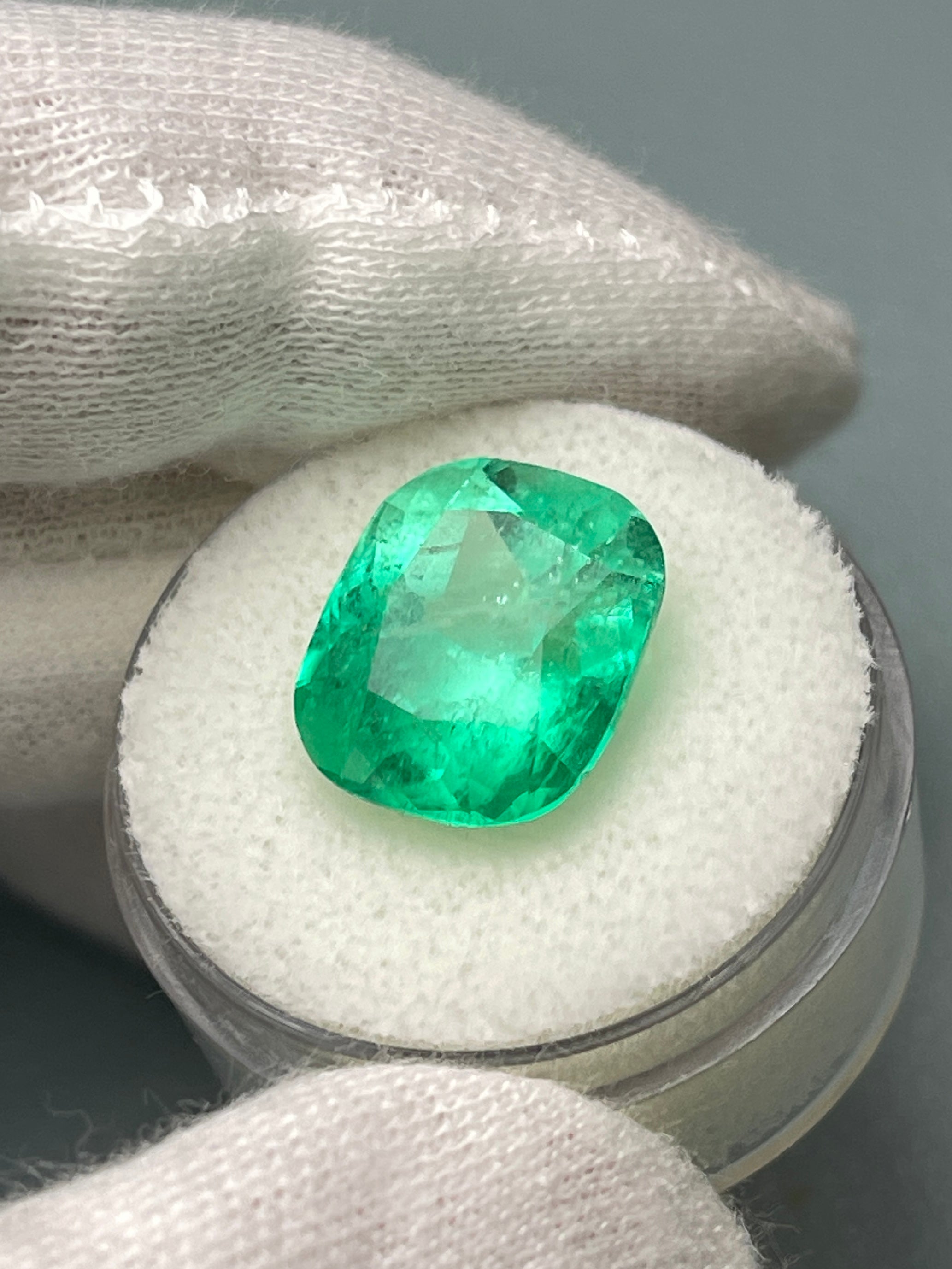 Natural loose Colombian emerald, 9.23 carats, cushion cut, yellowish green Muzo gemstone from JR Colombian Emeralds.
