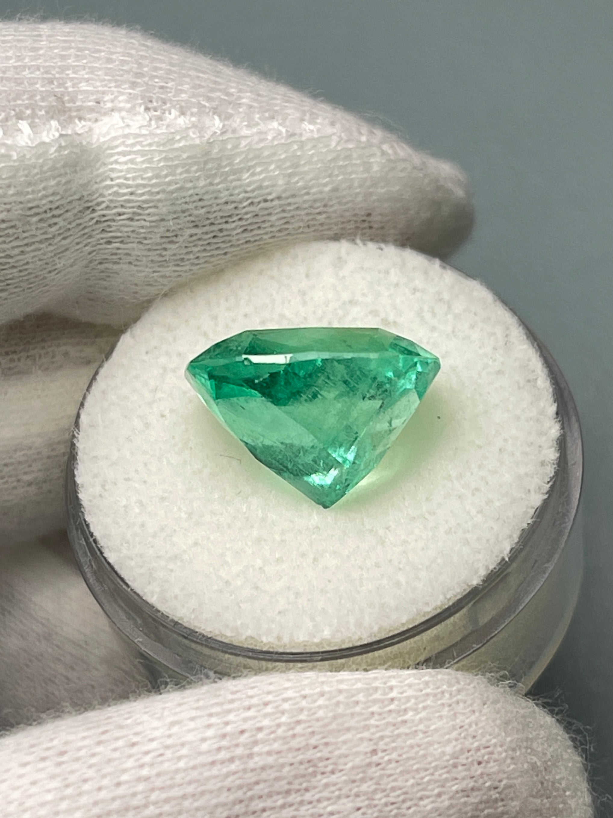 9.23 carat cushion cut Muzo yellowish-green Colombian emerald, loose natural gemstone from JR Colombian Emeralds.