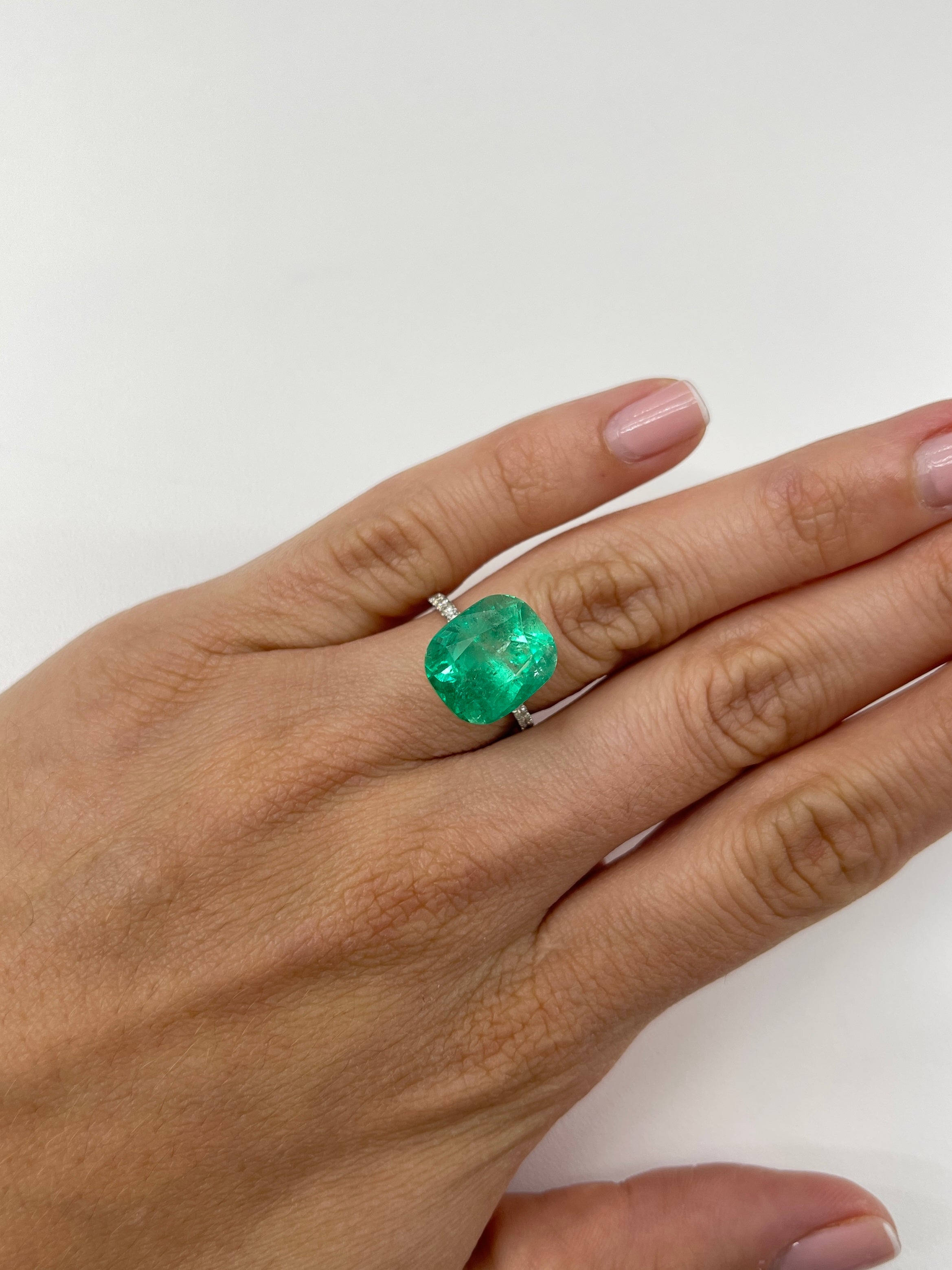 9.23-carat Muzo yellowish-green Colombian emerald, cushion cut, natural loose gemstone from JR Colombian Emeralds.
