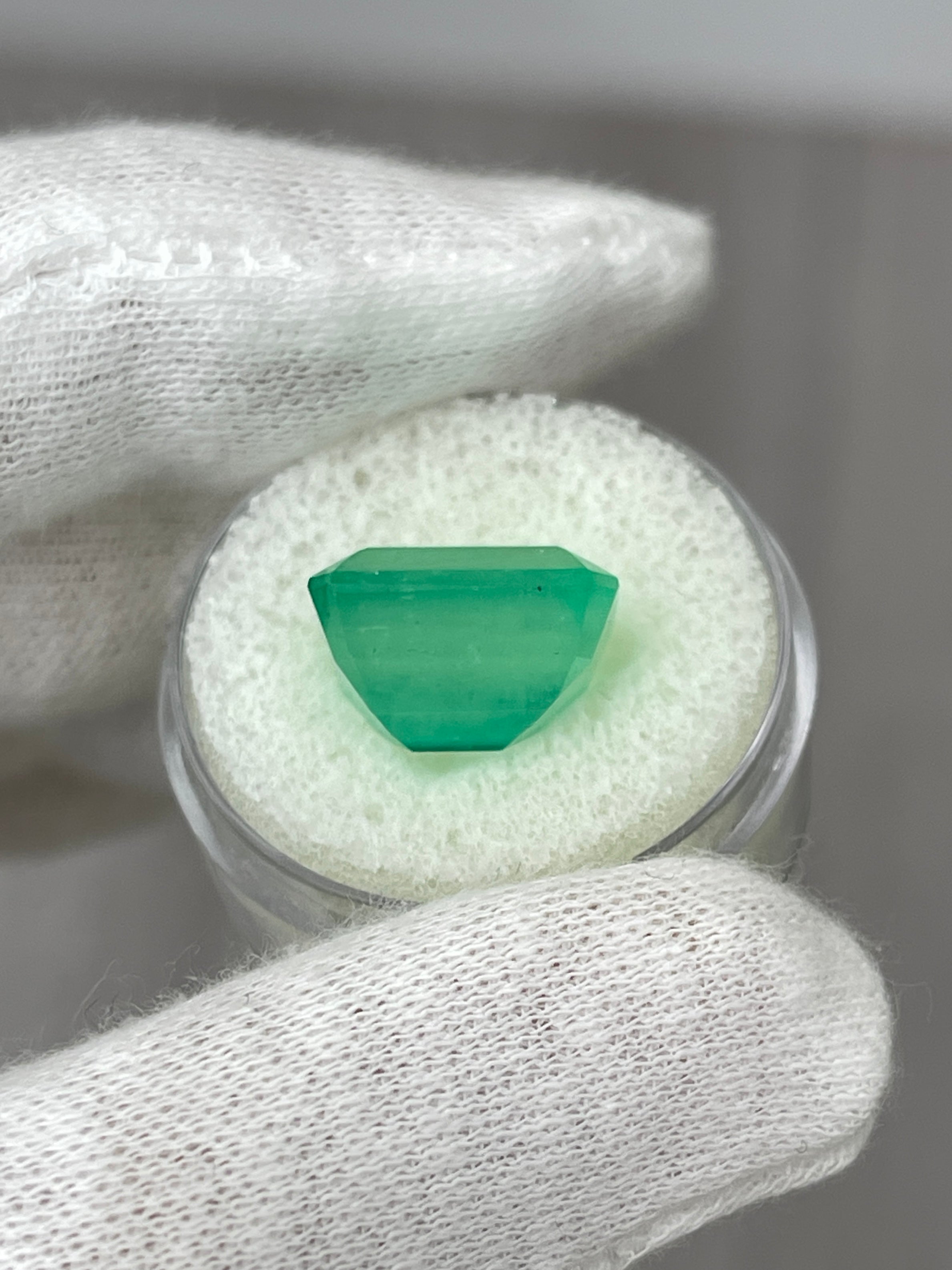 Medium green 9.29 carat Colombian emerald cut loose gemstone with earthy tone from JR Colombian Emeralds.