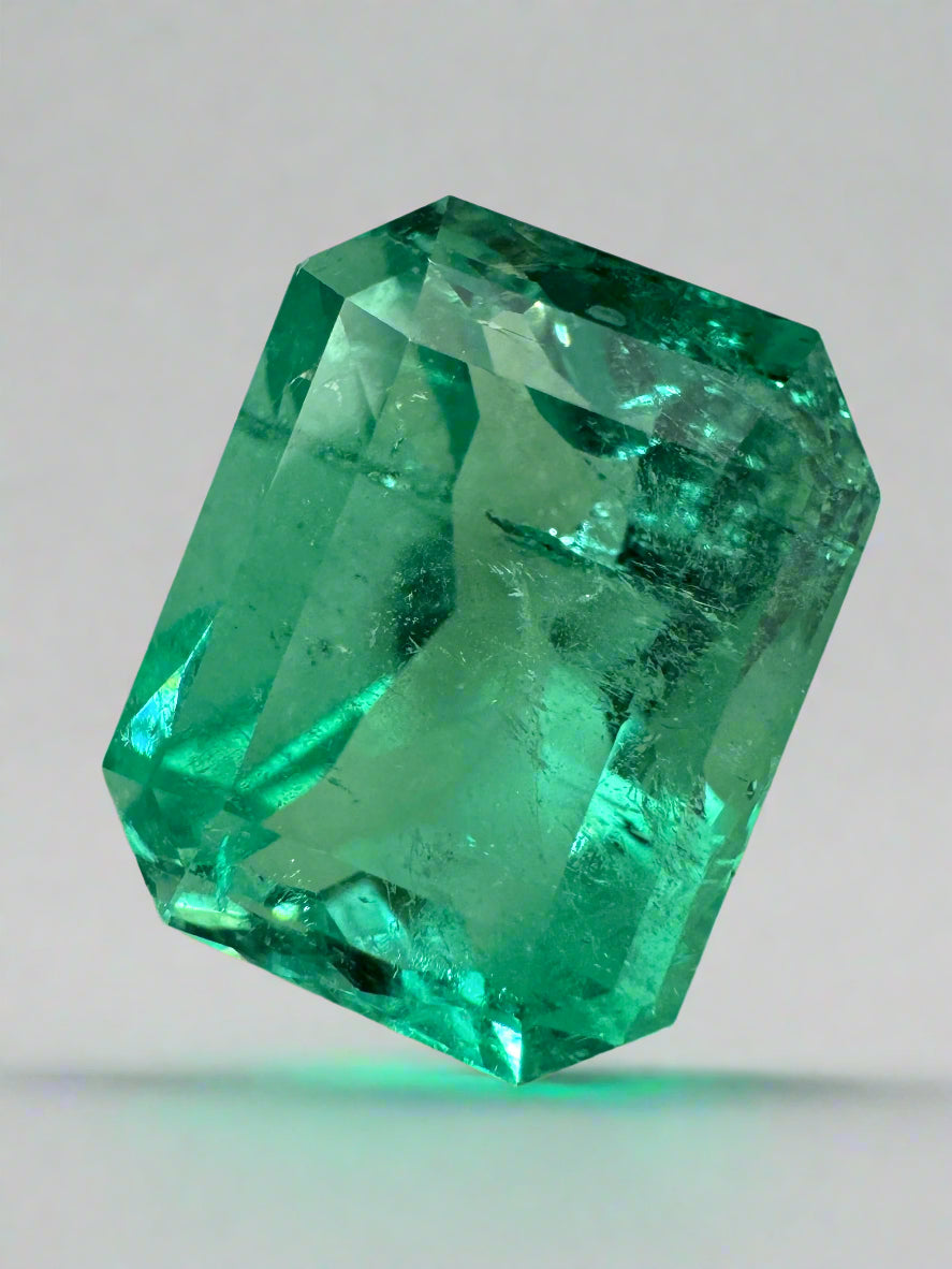 9.51 carat vivacious green Colombian emerald cut loose gemstone from JR Colombian Emeralds, showcasing its vibrant color and clarity.