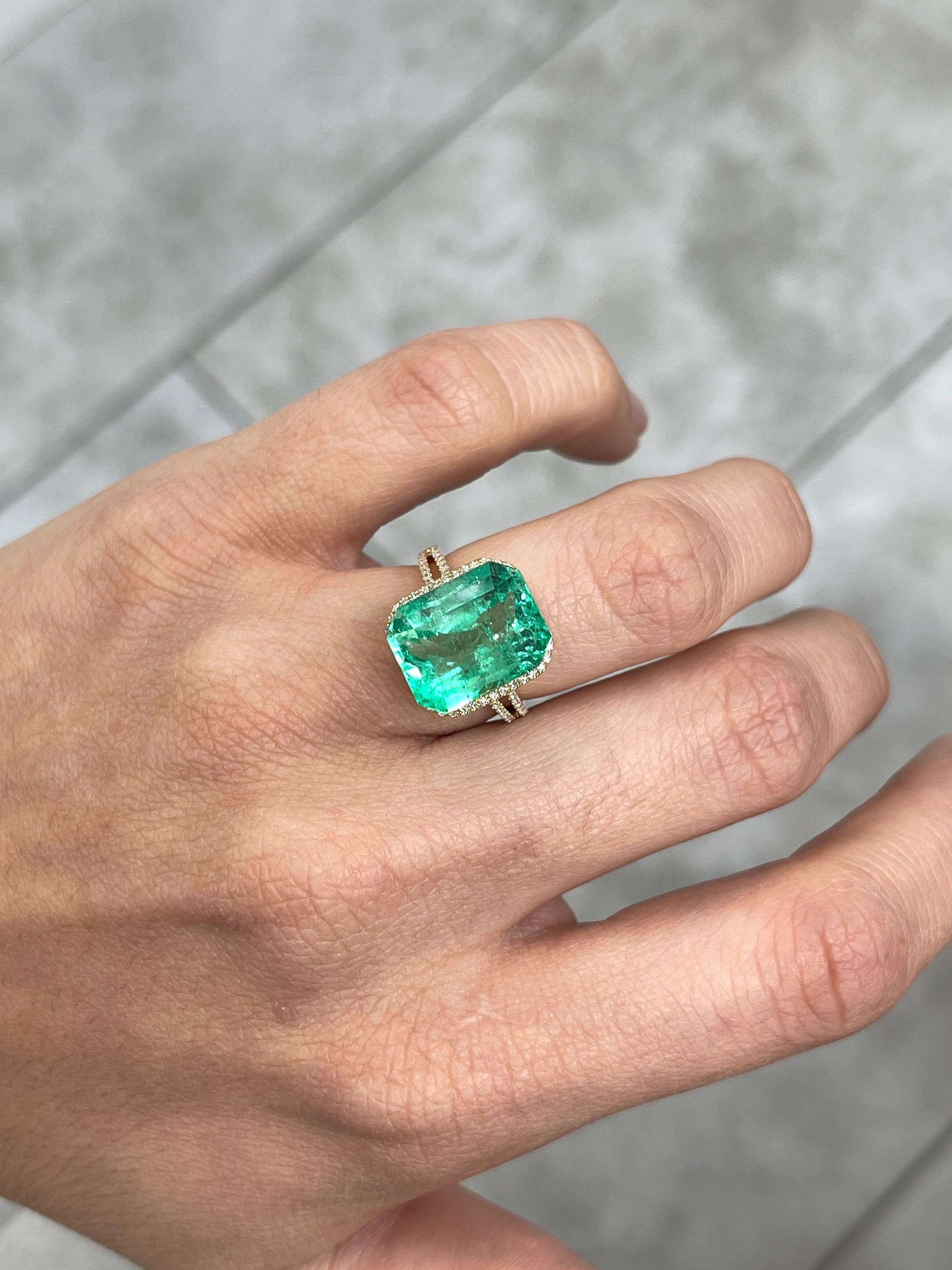 9.51 carat vivacious green Colombian emerald cut loose gemstone from JR Colombian Emeralds, showing clarity and vibrant color.