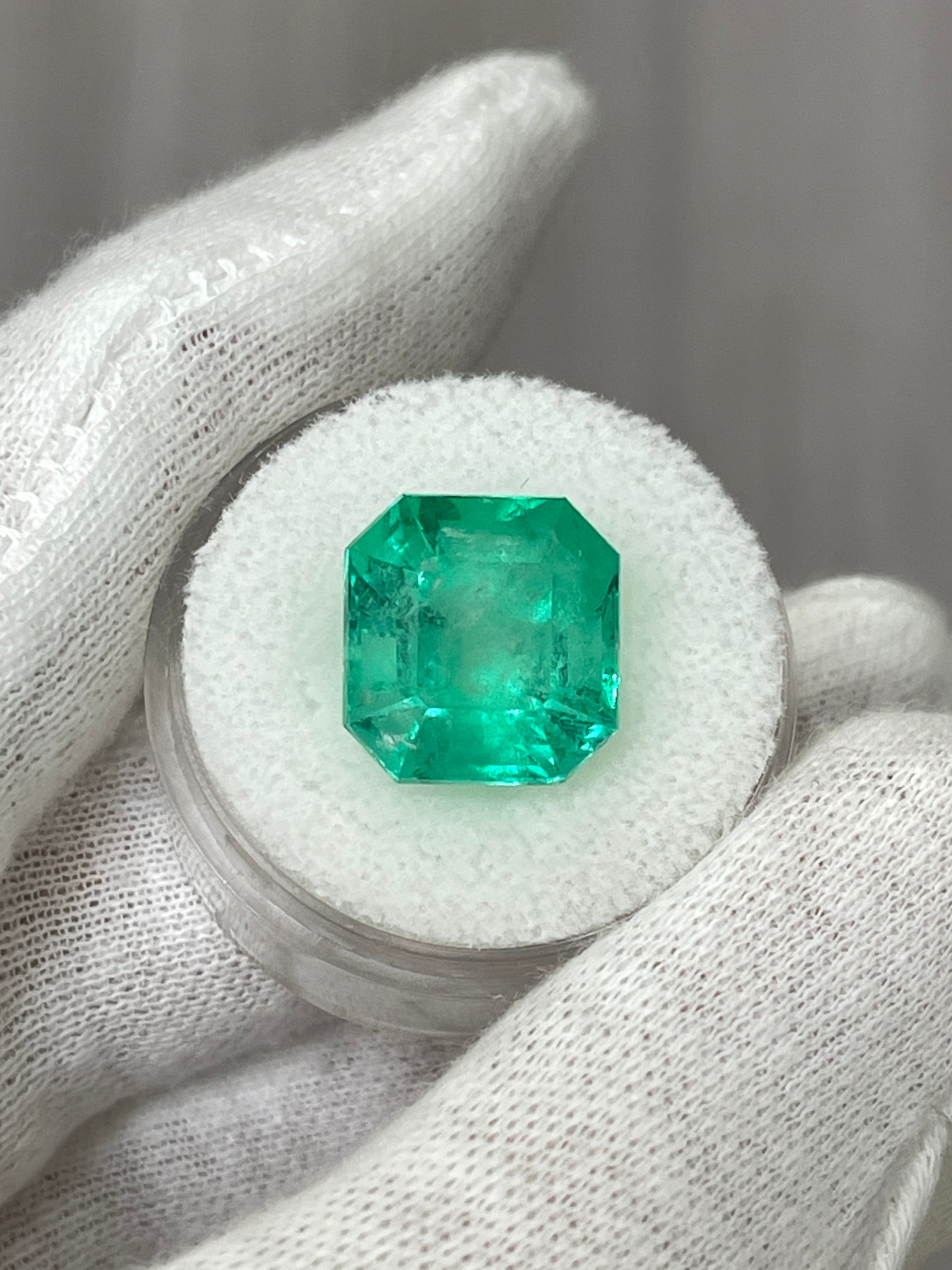 Medium green 9.79 carat Colombian emerald loose gemstone in classic Asscher cut, showcasing vibrant color and clarity.