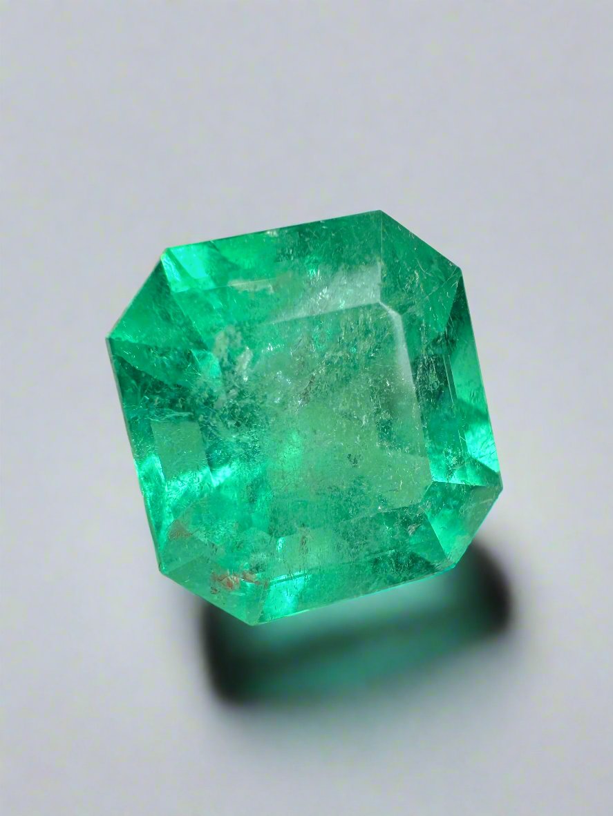 9.79-carat medium green natural Colombian emerald loose gemstone with classic Asscher cut, showcasing vibrant color and clarity.