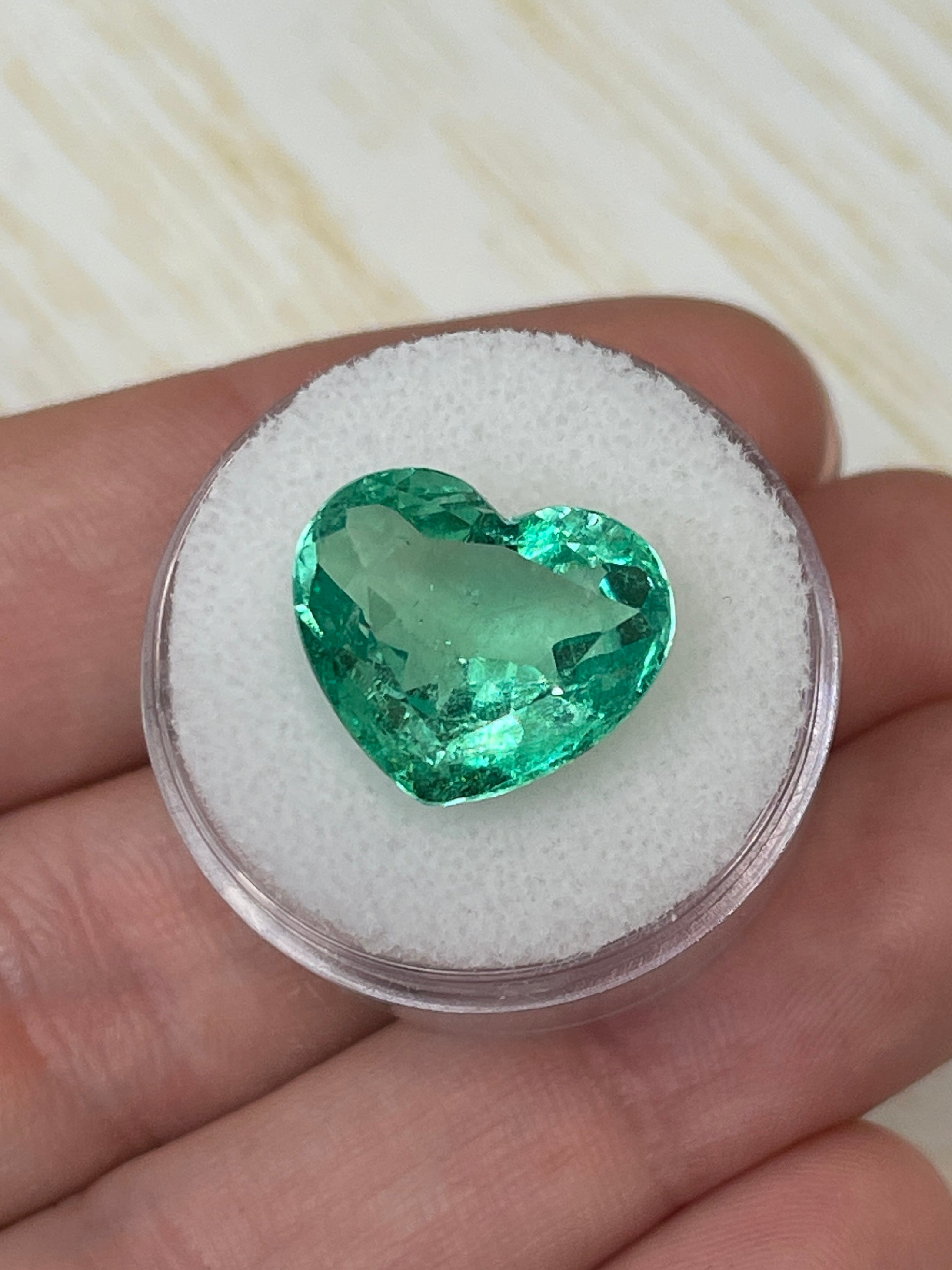 Natural loose Colombian emerald, 9.84 carats, 13x16mm heart cut, bubbly eye-clean, from JR Colombian Emeralds.