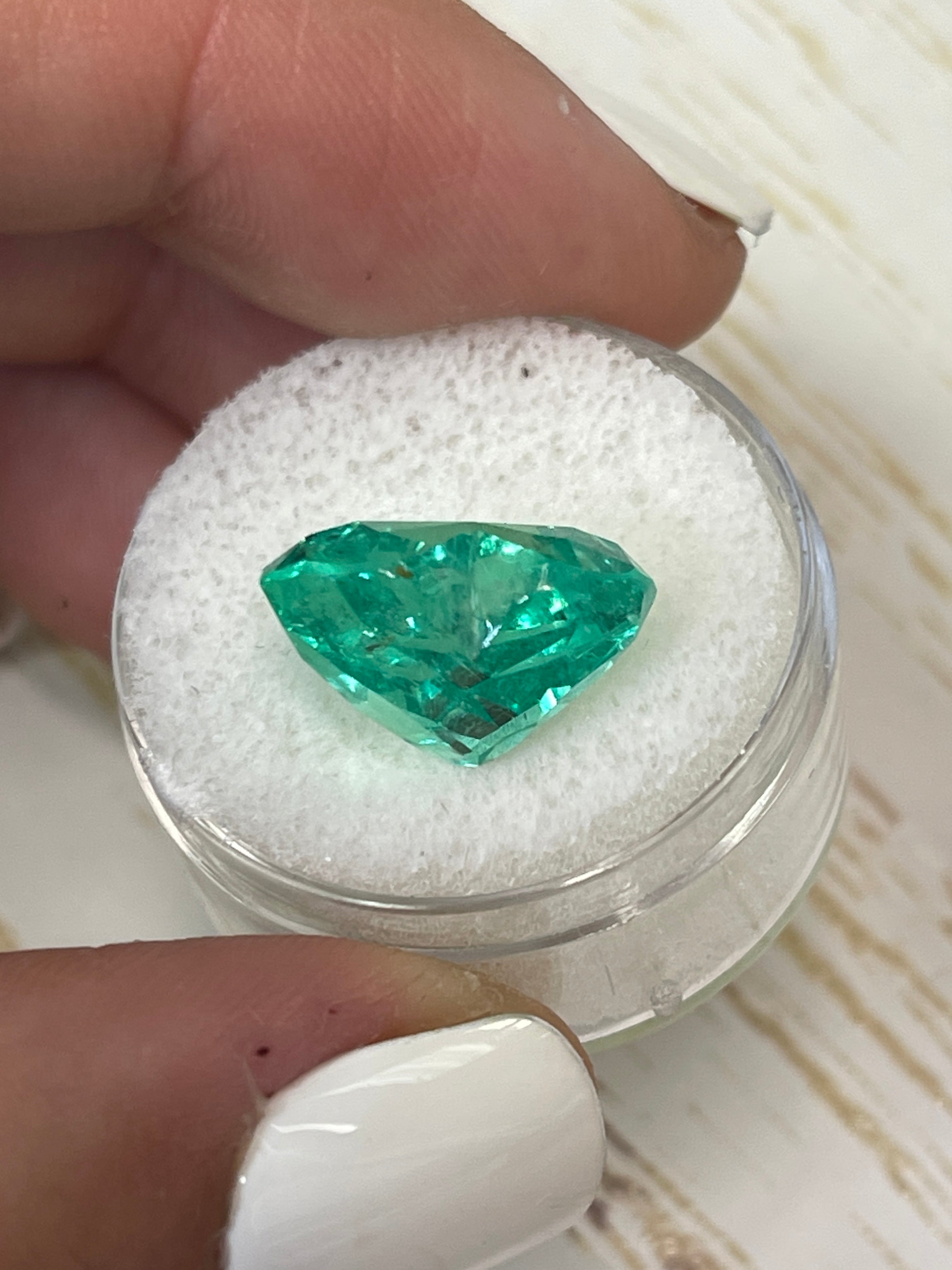 9.86 carat yellowish green Colombian emerald, heart cut, loose gemstone, natural and high-quality from JR Colombian Emeralds.