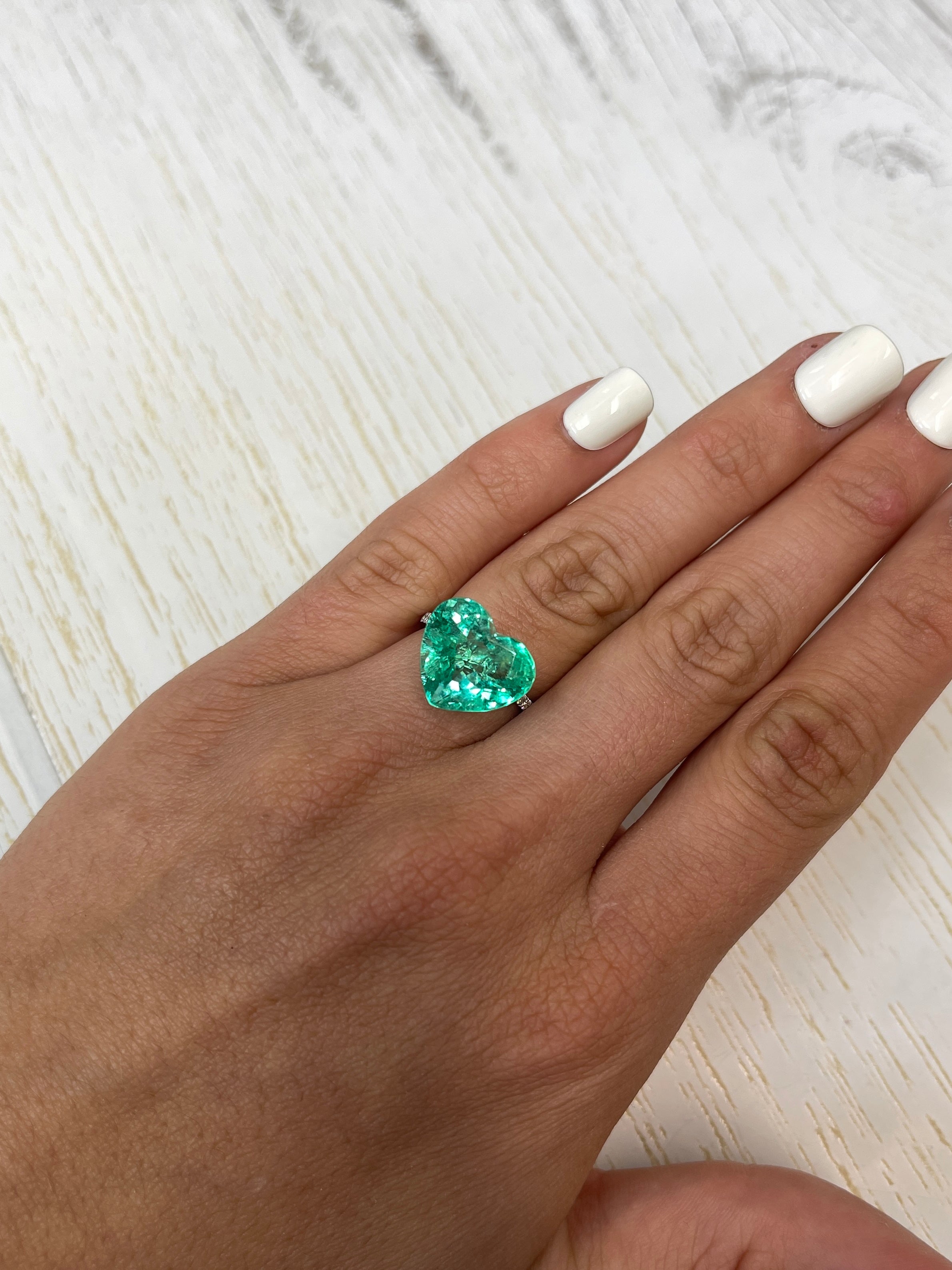 Natural loose Colombian emerald, 9.86 carats, heart cut, yellowish green, from JR Colombian Emeralds.
