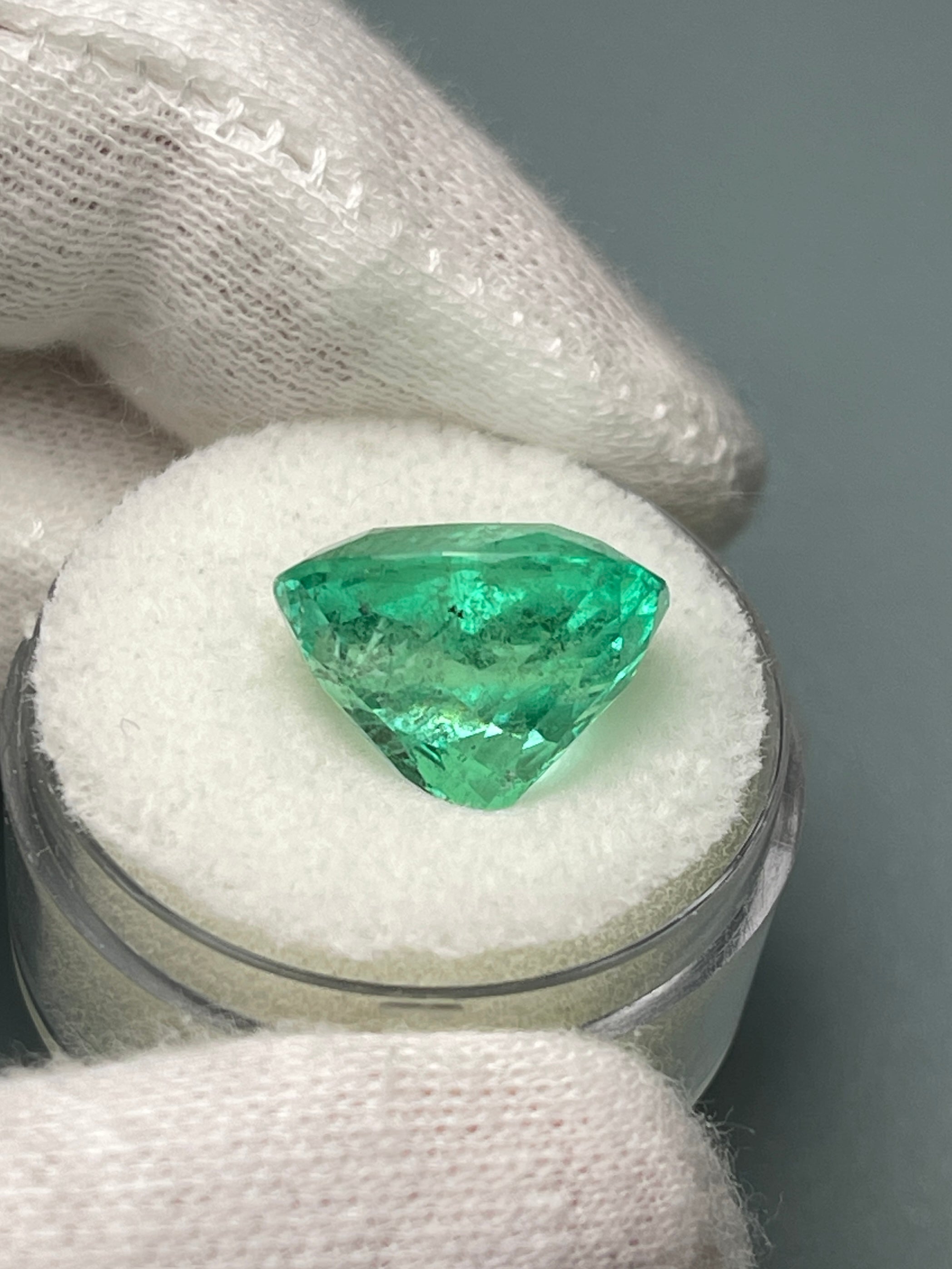9.89 carat spring green Colombian emerald loose cushion cut gemstone from JR Colombian Emeralds, natural and vibrant.