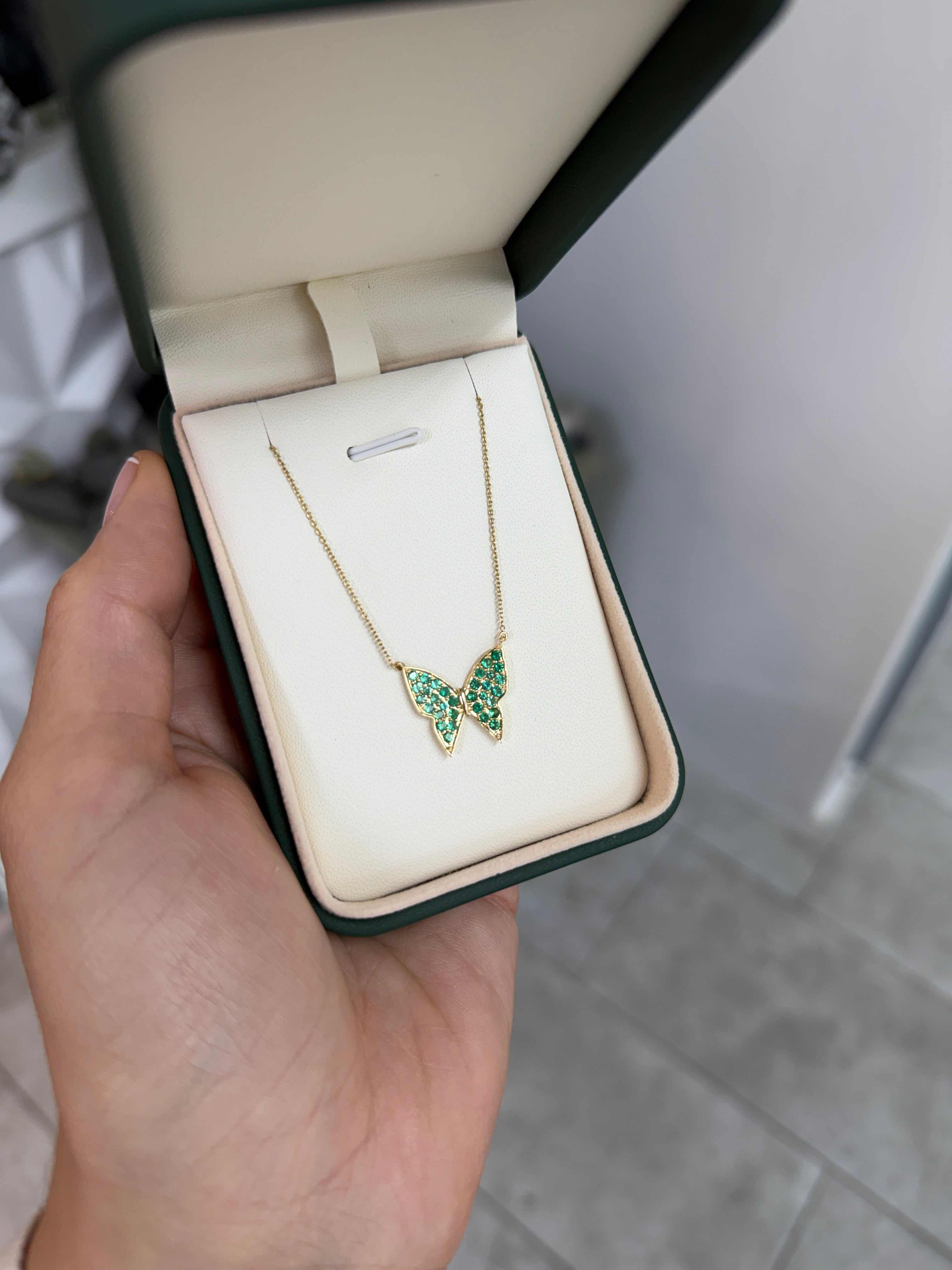 14K gold butterfly necklace with pave emeralds, as seen on Instagram, featuring delicate fluttering butterfly design from JR Colombian Emeralds