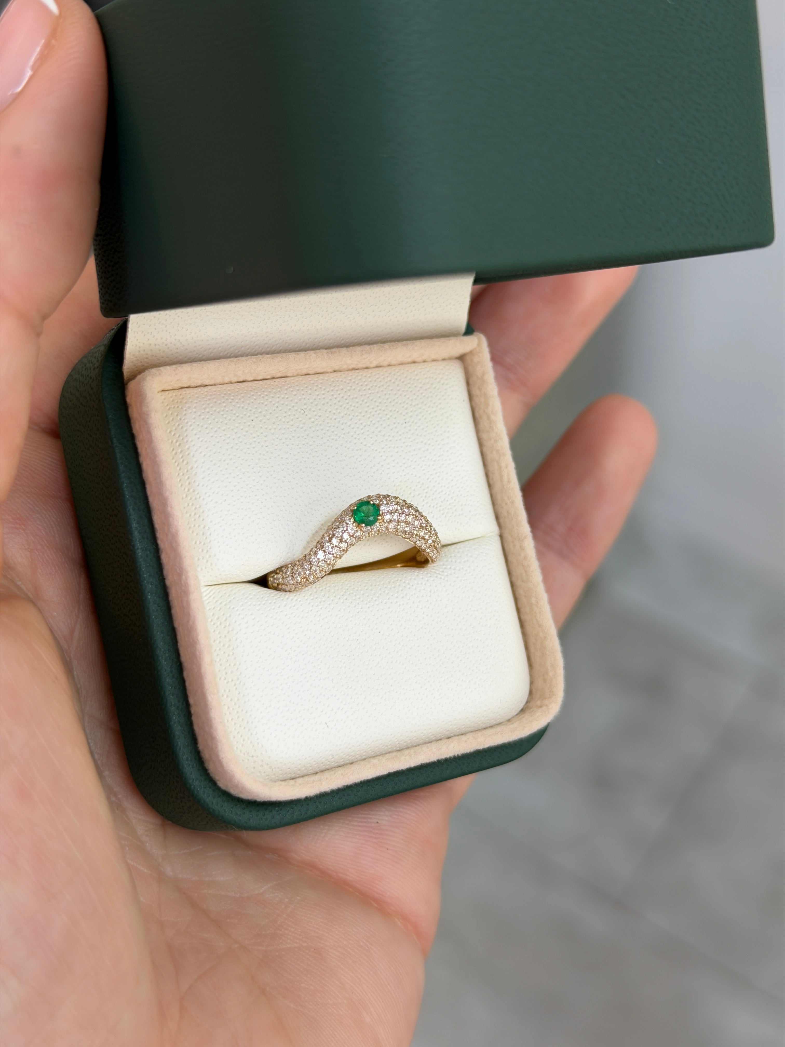 Custom curved emerald and diamond pave wedding band in 14K gold, size 7, from JR Colombian Emeralds.