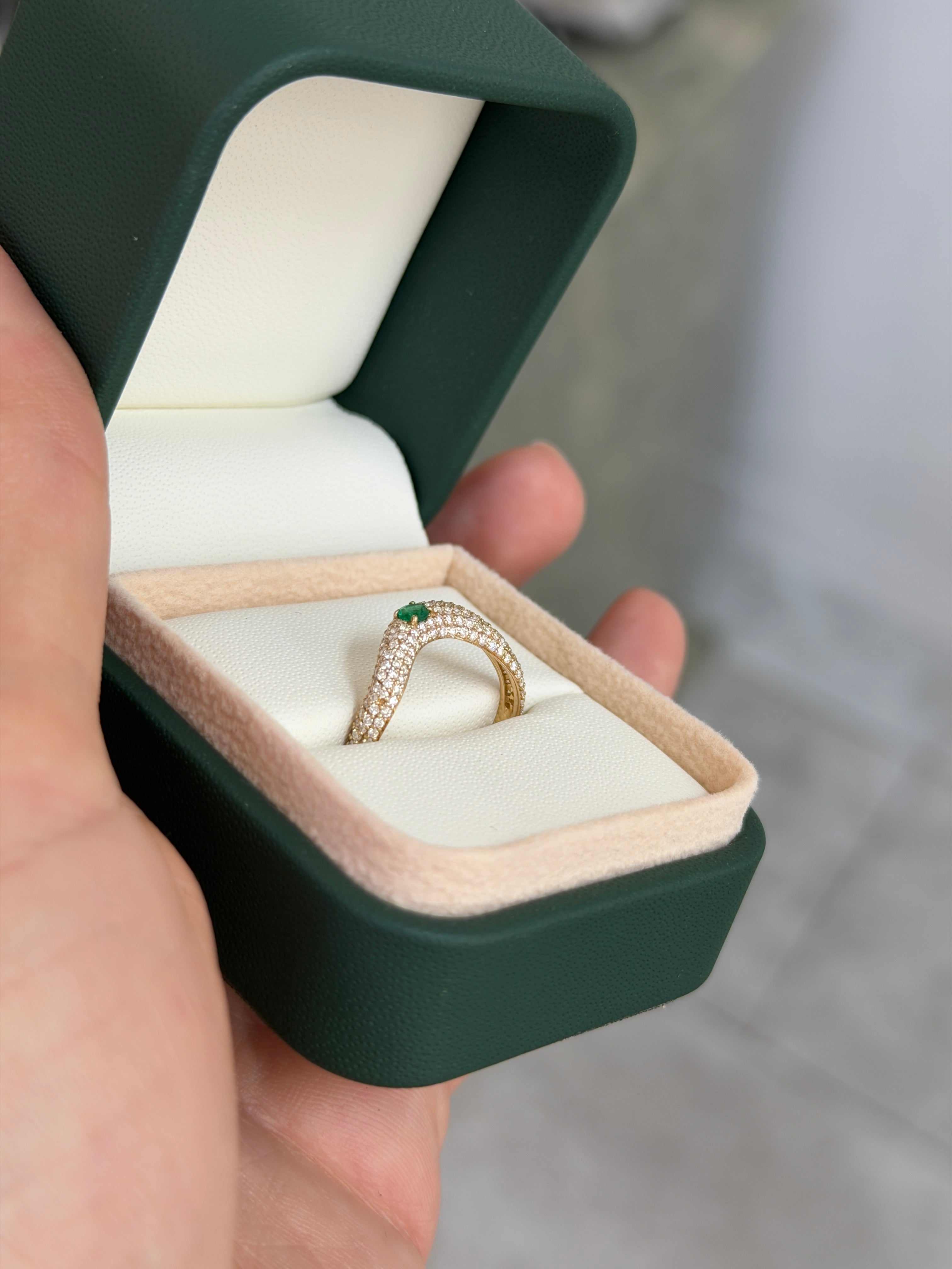 Custom curved 14K emerald and diamond pave wedding band by JR Colombian Emeralds, size 7, featuring vibrant green emeralds and sparkling diamonds.