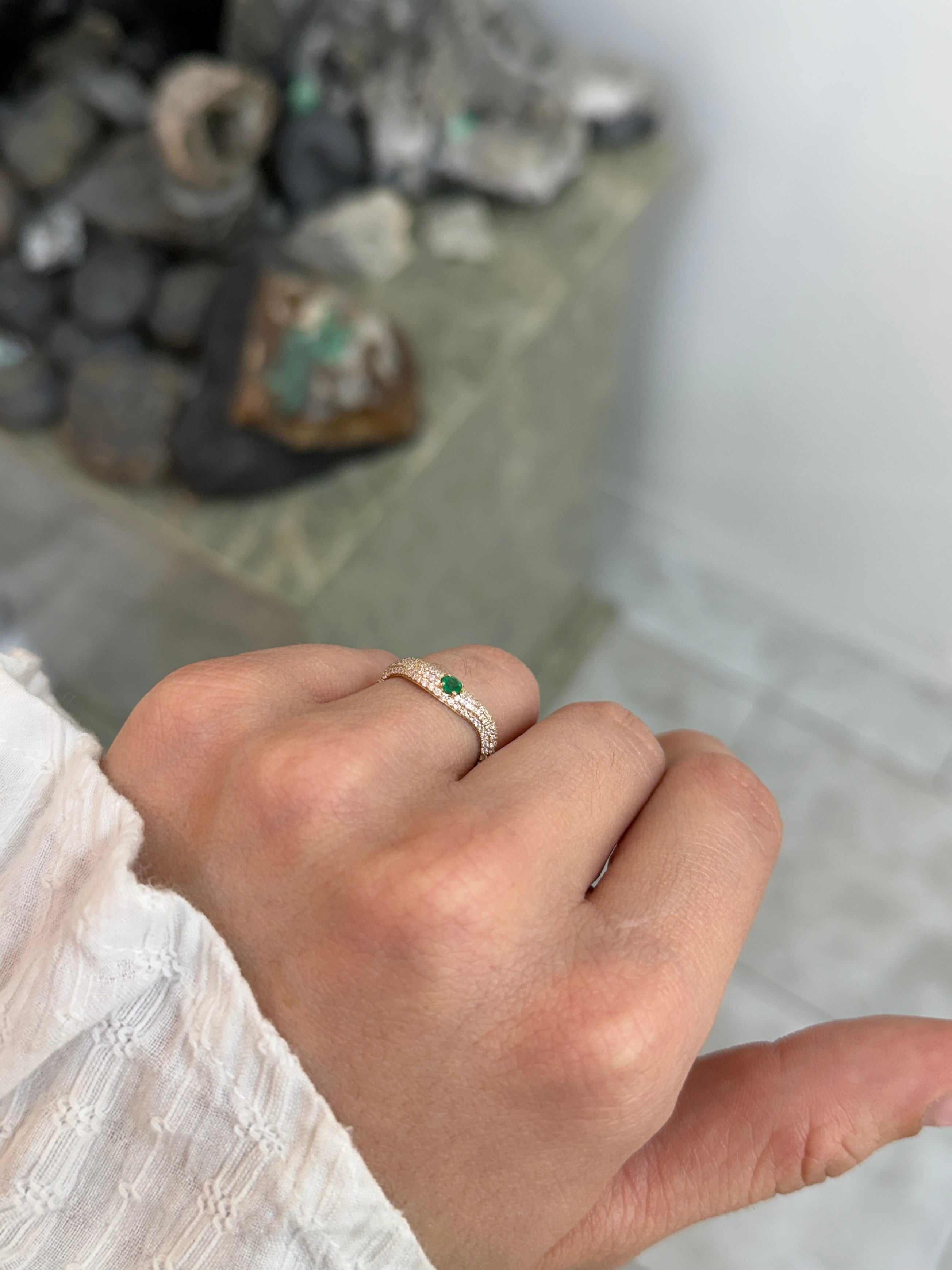 Custom 14K curved emerald and diamond pave wedding band by JR Colombian Emeralds, size 7, featuring green emeralds and sparkling diamonds.