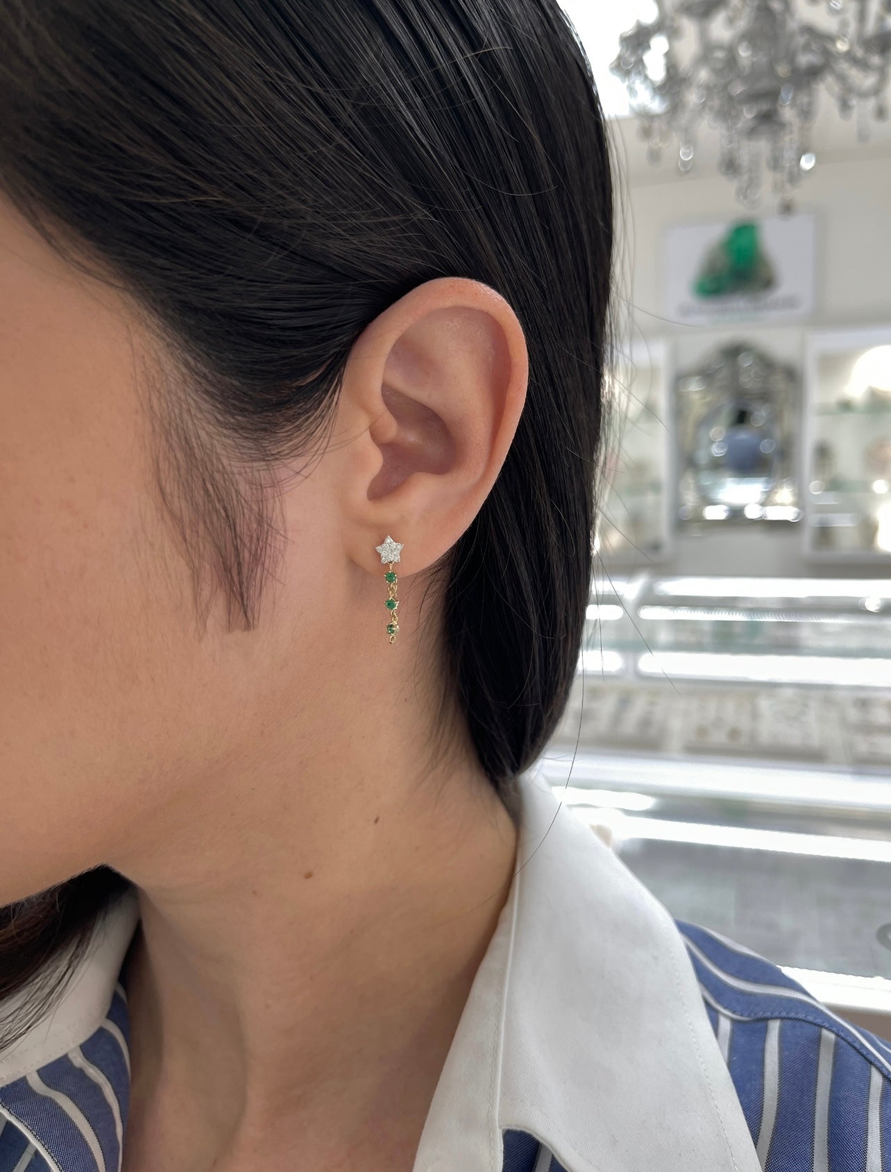 Emerald and diamond twinkle dangle earrings in 14K gold from JR Colombian Emeralds featuring vibrant green emeralds and sparkling diamonds.