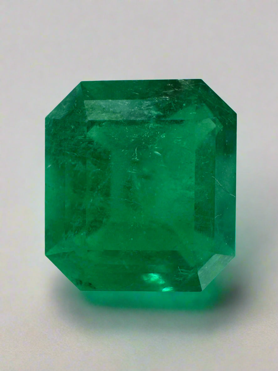 Large 10.13 carat Muzo Colombian emerald loose gemstone, emerald cut with deep jungle green color, from JR Colombian Emeralds.