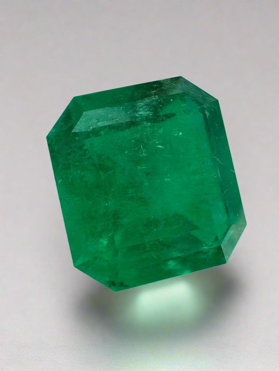 Large 10.13 carat Muzo Colombian emerald loose gemstone with an emerald cut, deep jungle green color, from JR Colombian Emeralds.