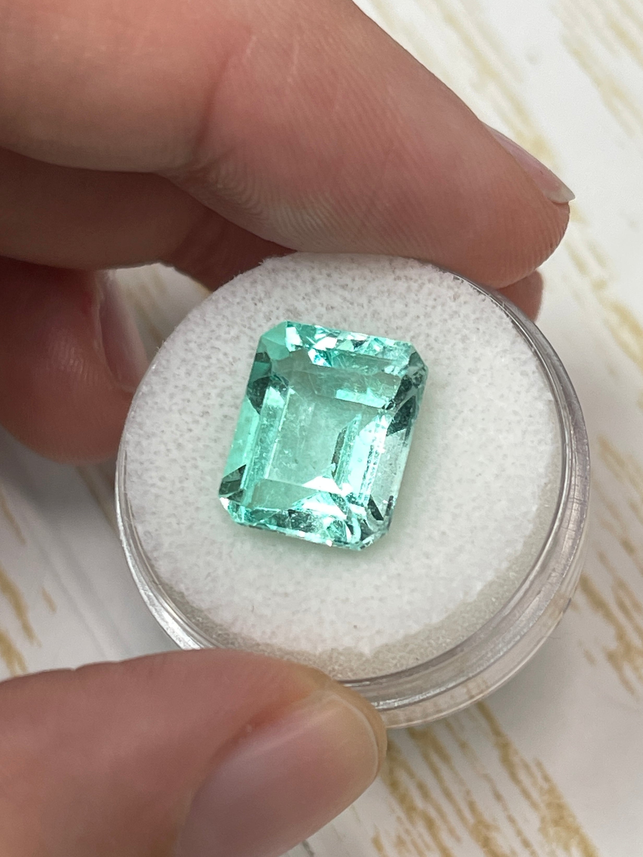 Large 10.26 carat VS Jyotish Colombian emerald cut loose emerald from JR Colombian Emeralds showing vibrant green gemstone.
