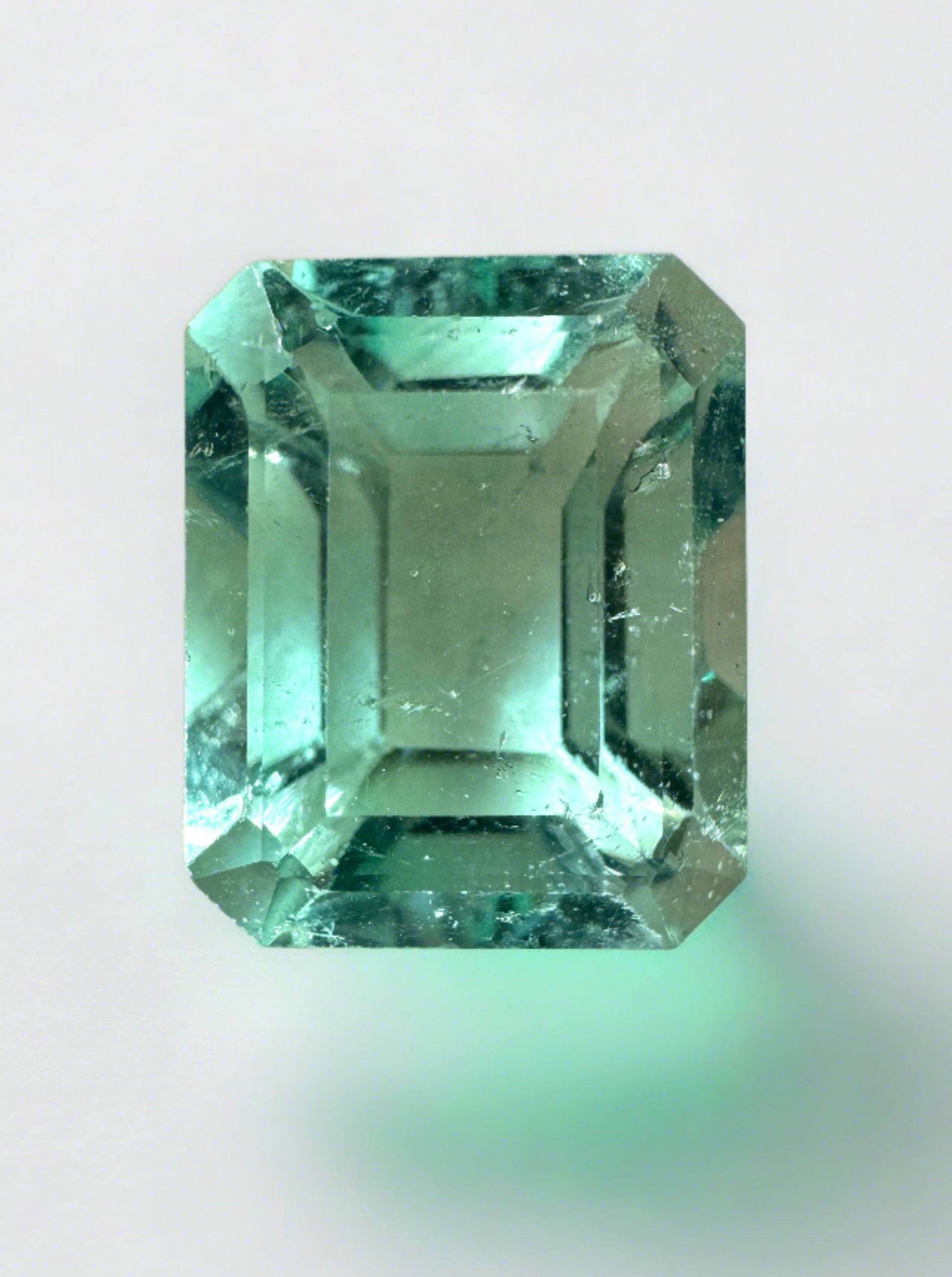 Large 10.26 carat VS Colombian emerald cut loose emerald from JR Colombian Emeralds, vibrant green gemstone with clarity.