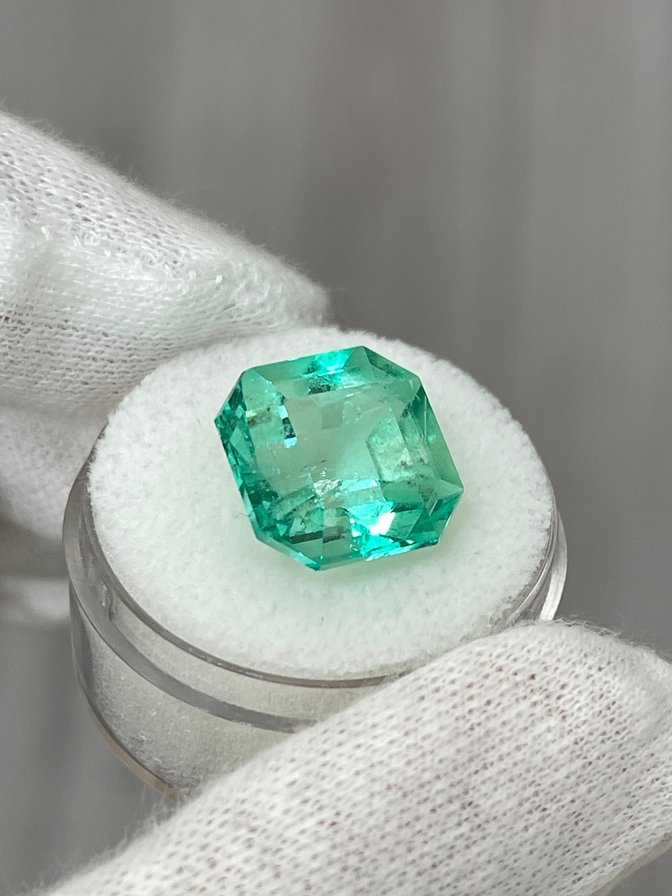 Large 13x13mm Asscher cut Colombian emerald gemstone with vibrant green color and natural clarity, from JR Colombian Emeralds.